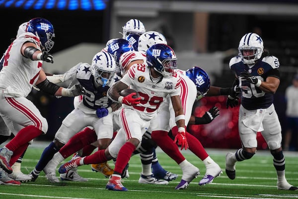 New York Giants running back Tyrone Tracy Jr. (29) runs against the Dallas Cowboys during the second half of an NFL football game in Arlington, Texas, Thursday, Nov. 28, 2024. (AP Photo/Tony Gutierrez)