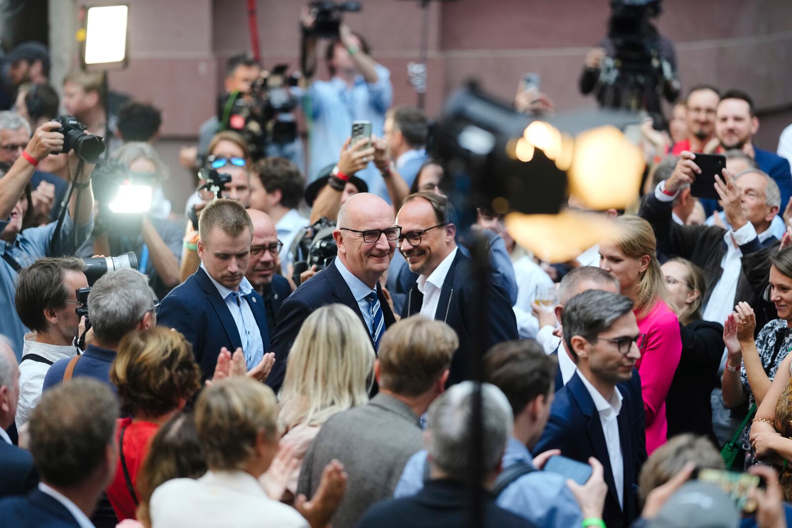 Governor of Brandenburg and Germany's Social Democratic Party, SPD, for the state election Dietmar Woidke, center, arrives at the party's election event after first exit polls announced in Potsdam, Germany, Sunday, Sept. 22, 2024. (AP Photo/Markus Schreiber)