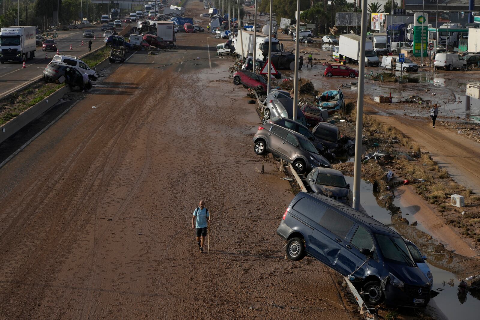 Vehicles are seen piled up after being swept away by floods on a motorway in Valencia, Spain, Thursday, Oct. 31, 2024. (AP Photo/Manu Fernandez)