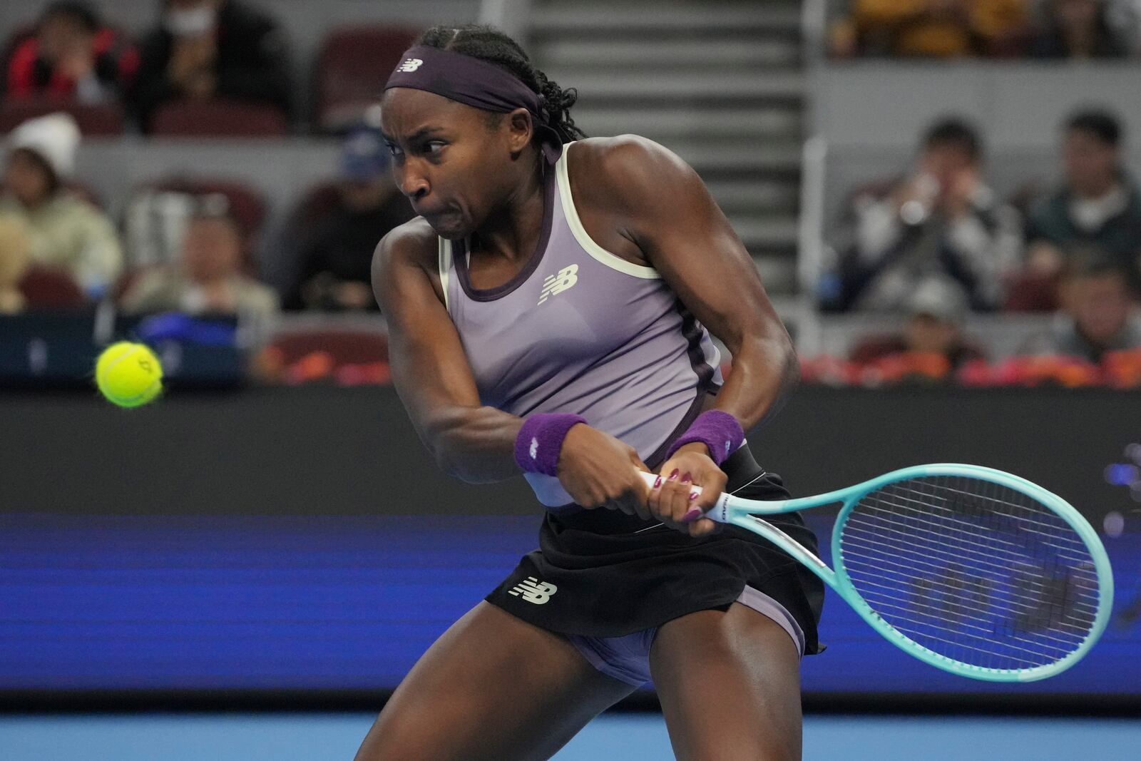 Coco Gauff of the United States returns the ball to Naomi Osaka of Japan in in a women's singles match for the China Open tennis tournament held at the National Tennis Center in Beijing, Tuesday, Oct. 1, 2024.(AP Photo/Achmad Ibrahim)