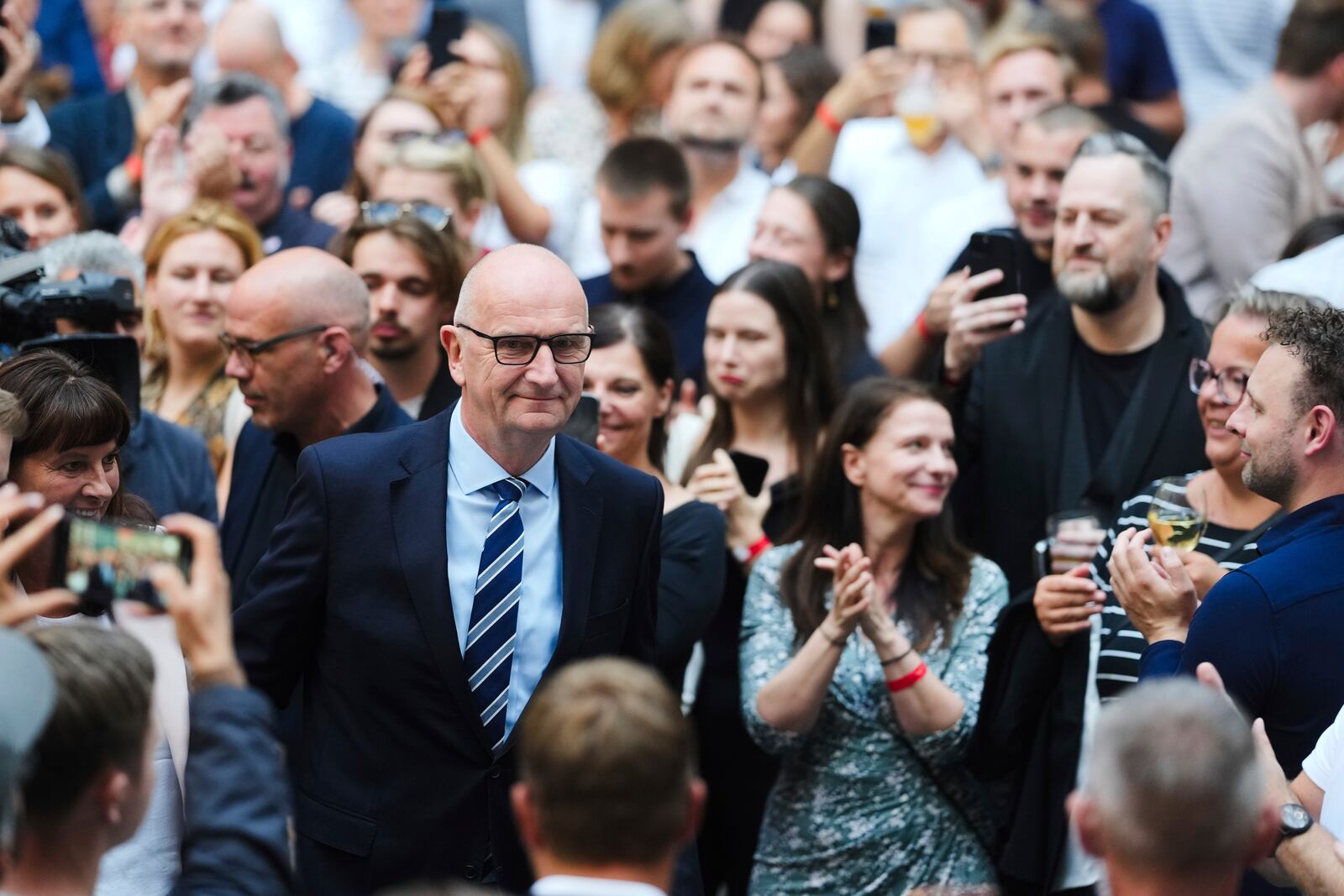 Governor of Brandenburg and Germany's Social Democratic Party, SPD, for the state election Dietmar Woidke, center, arrives at the party's election event after first exit polls announced in Potsdam, Germany, Sunday, Sept. 22, 2024. (AP Photo/Markus Schreiber)