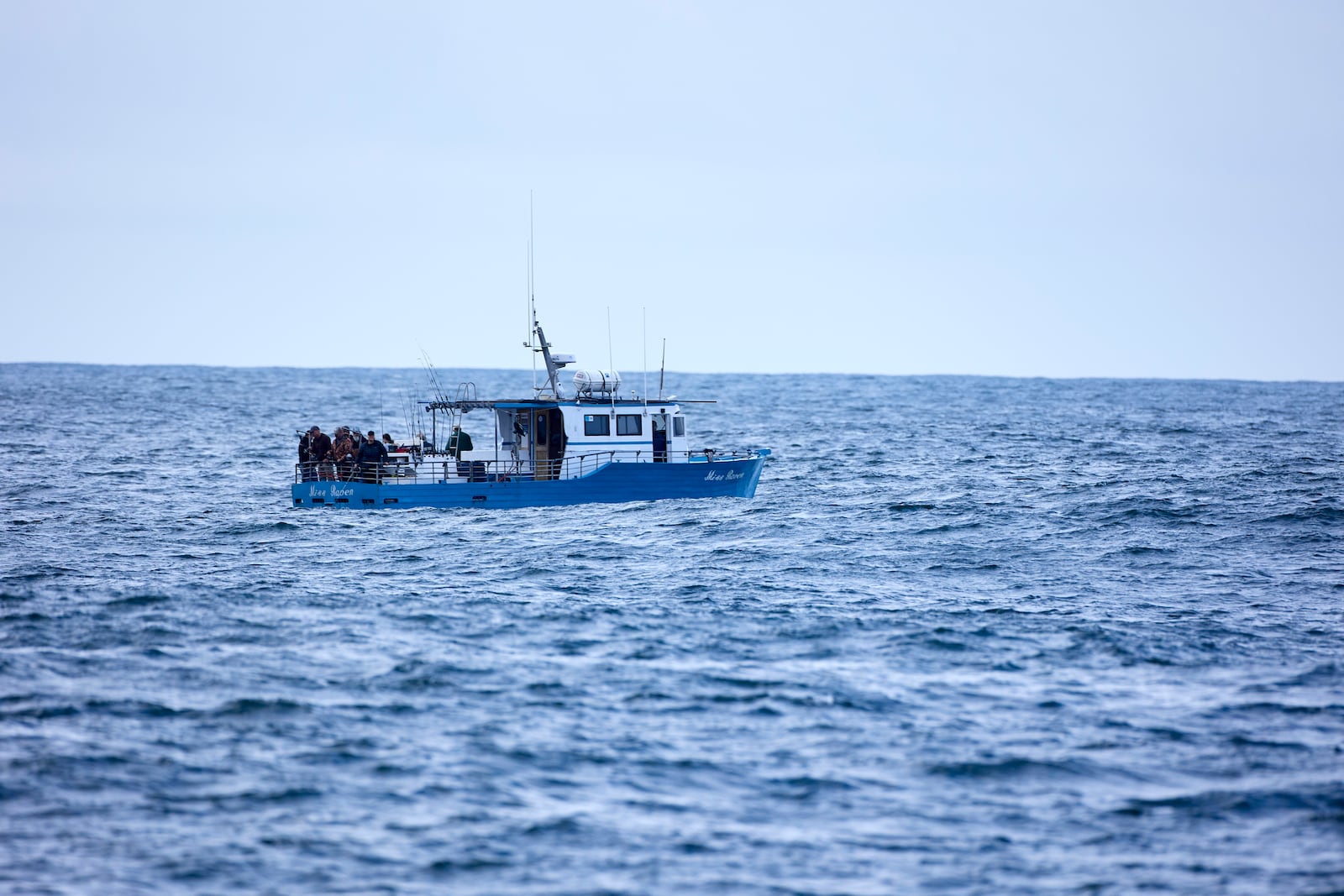 Fishermen fish in the Pacific Ocean near the wave energy test site near Newport, Ore., Friday, Aug. 23, 2024. Private developers will be able to use the site to test devices that they've designed to harness energy from waves. (AP Photo/Craig Mitchelldyer)