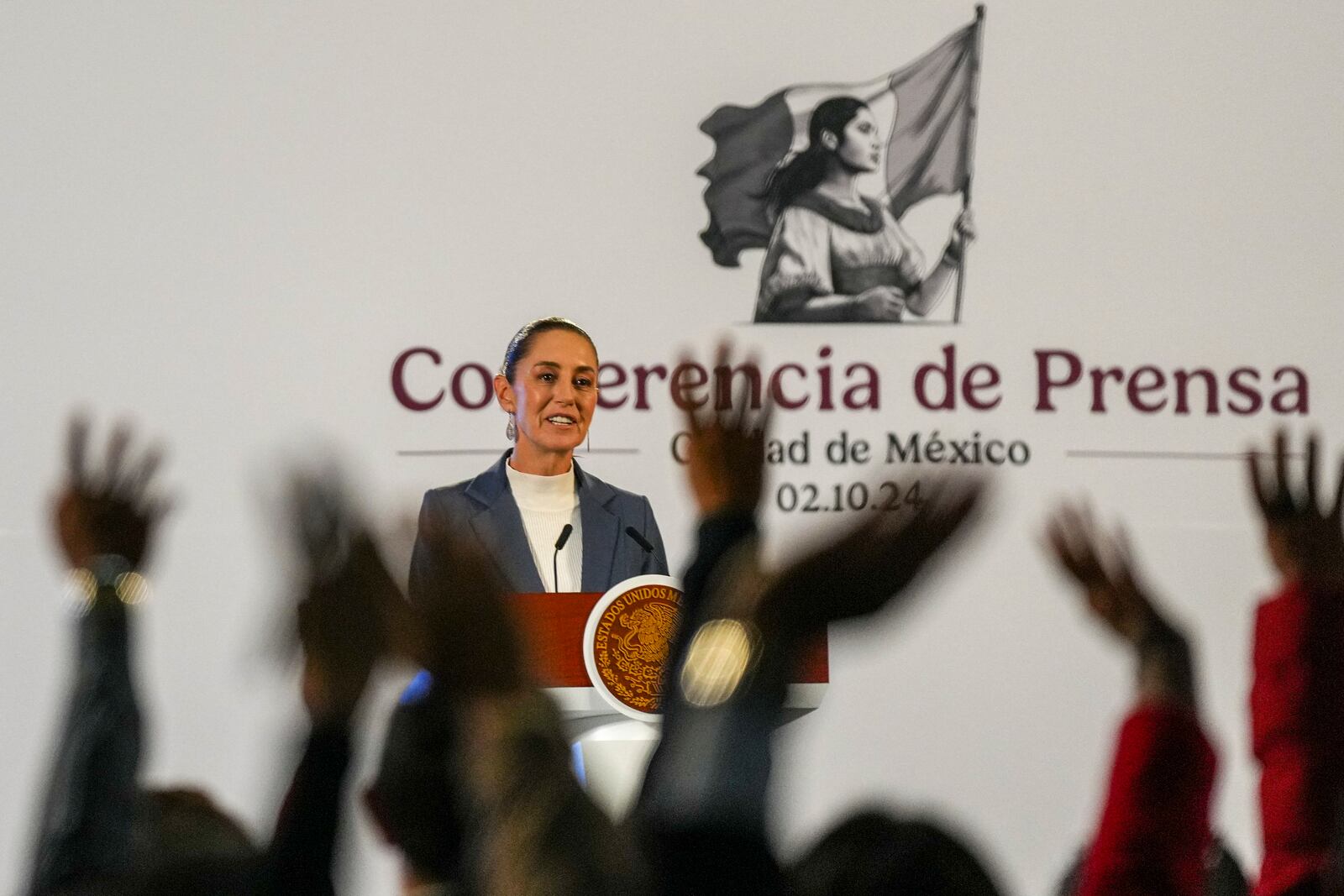 Mexican President Claudia Sheinbaum gives a media briefing from the National Palace in Mexico City, Wednesday, Oct. 2, 2024, the morning after her inauguration. (AP Photo/Fernando Llano)