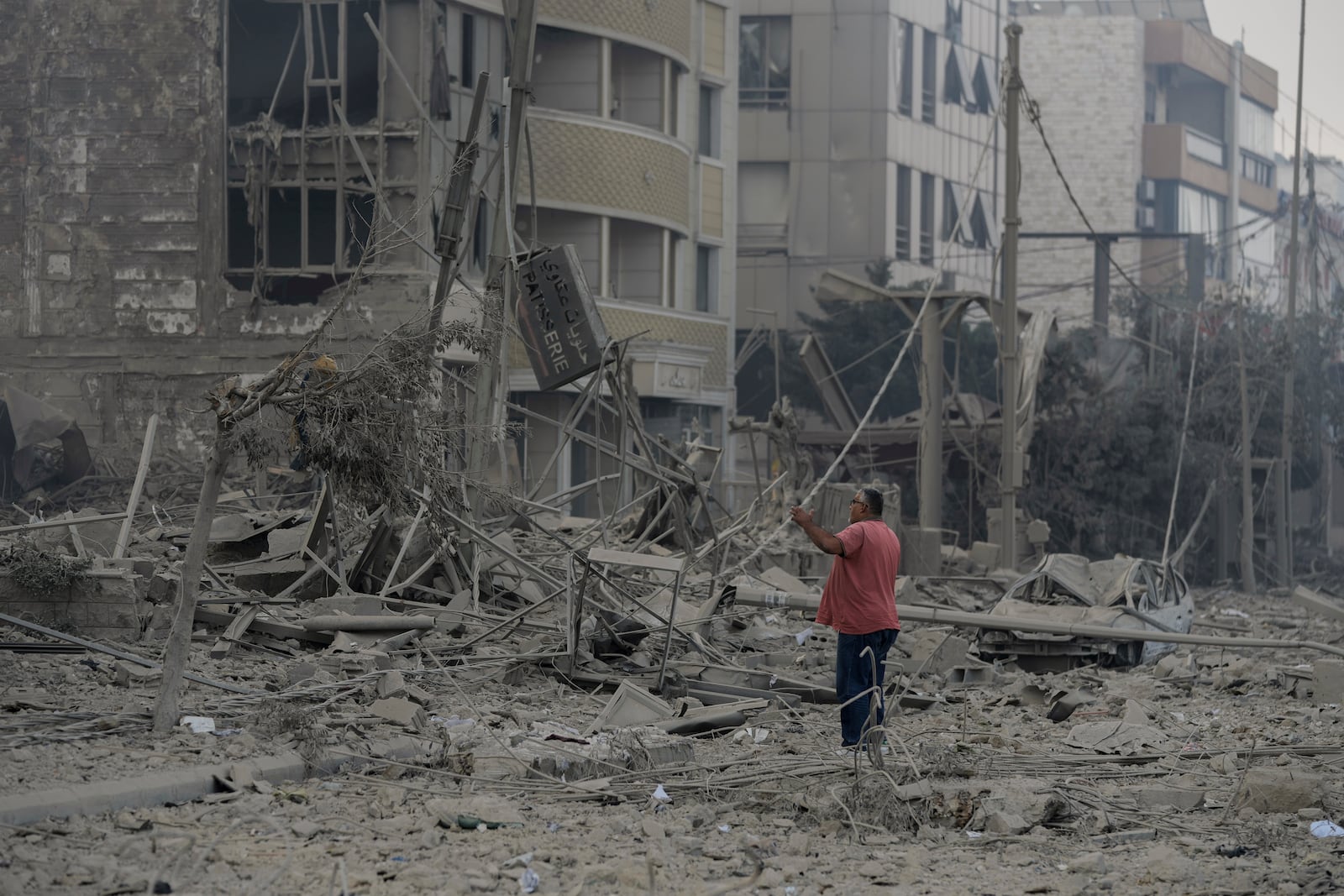 A man checks the site of an Israeli airstrike in Dahiyeh, Beirut, Lebanon, Sunday, Oct. 6, 2024. (AP Photo/Bilal Hussein)