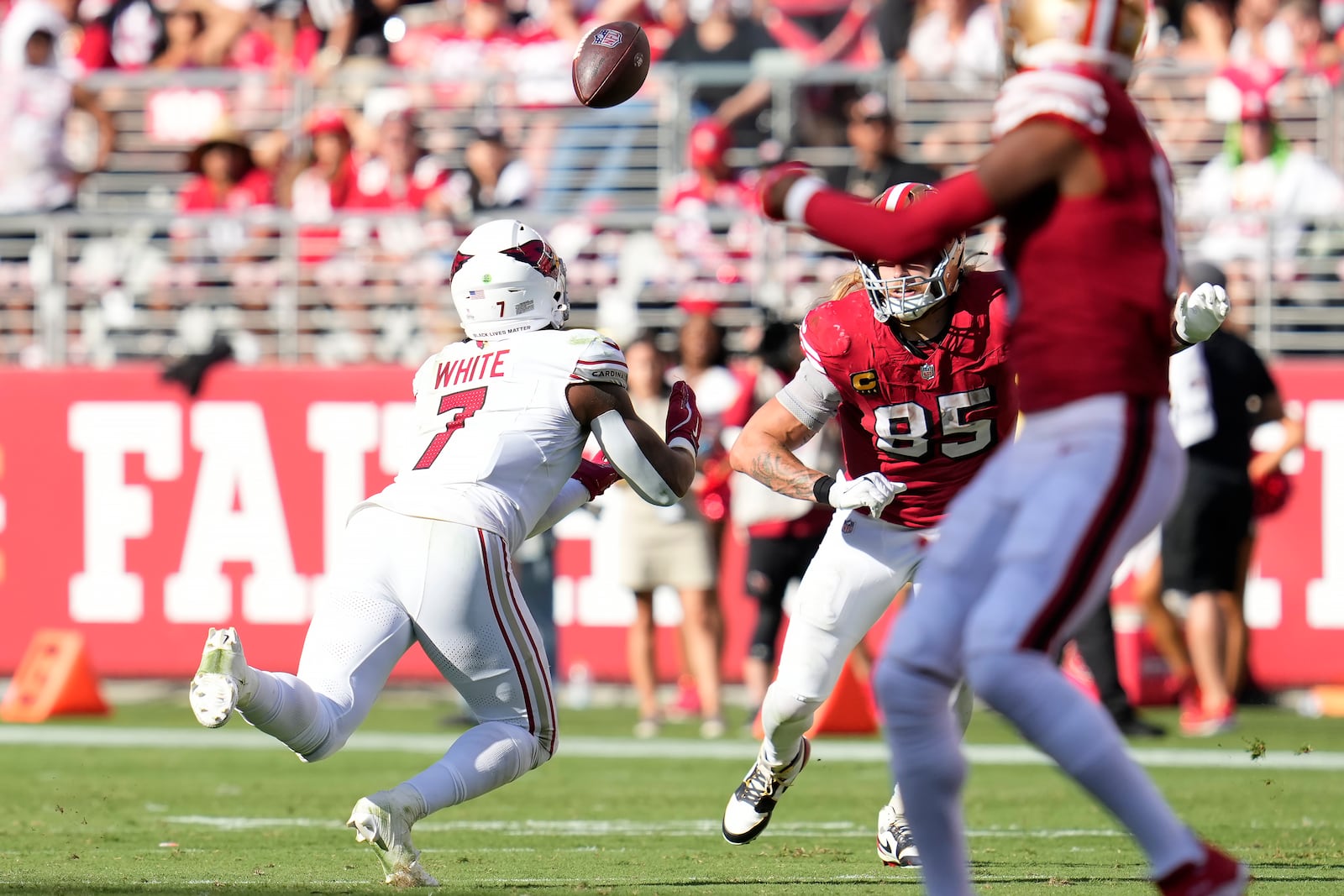 Arizona Cardinals linebacker Kyzir White (7) intercepts a pass in front of San Francisco 49ers tight end George Kittle (85) during the second half of an NFL football game in Santa Clara, Calif., Sunday, Oct. 6, 2024. (AP Photo/Godofredo A. Vásquez)