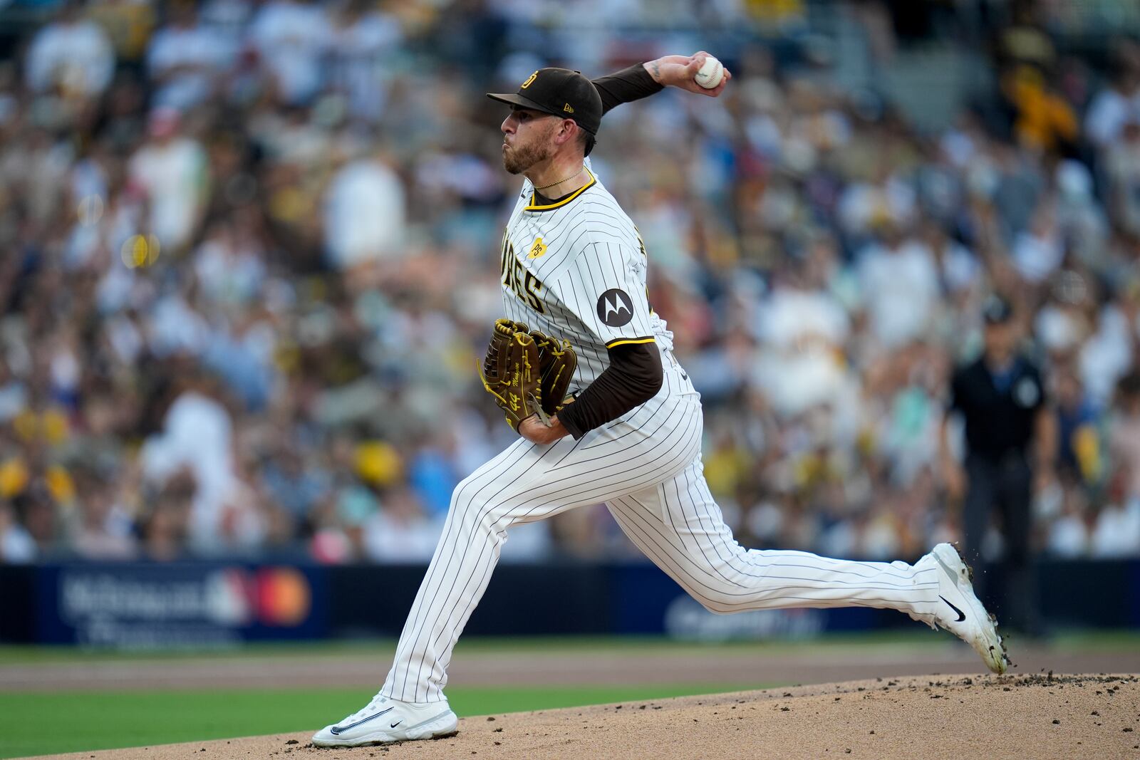 San Diego Padres starting pitcher Joe Musgrove throws to an Atlanta Braves batter during the first inning in Game 2 of an NL Wild Card Series baseball game Wednesday, Oct. 2, 2024, in San Diego. (AP Photo/Gregory Bull)