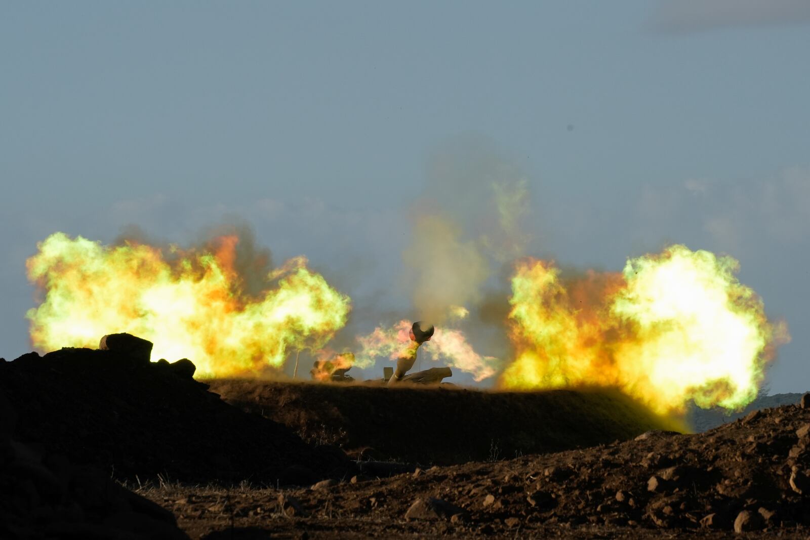 An Israeli mobile artillery unit fires a shell from northern Israel towards Lebanon, Wednesday, Oct. 2, 2024. (AP Photo/Baz Ratner)