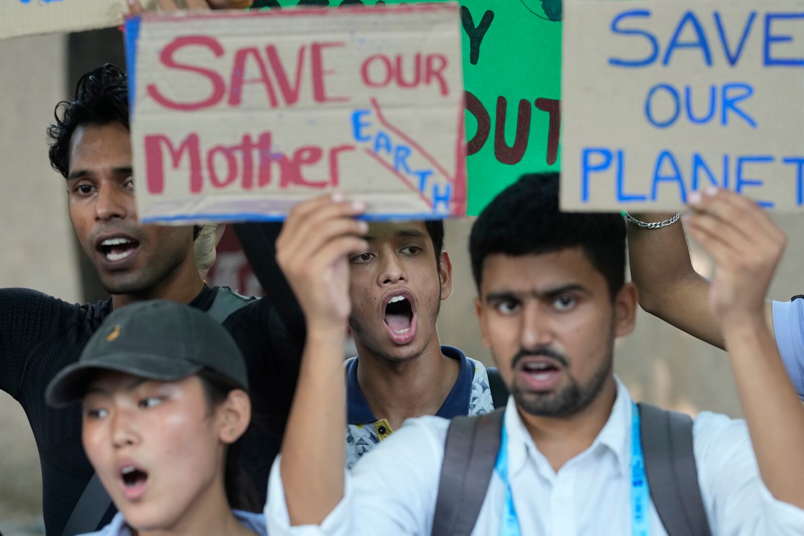 Activists shout slogans during a Global Climate Strike protest of the Fridays For Future' movement demanding immediate climate action from policymakers in New Delhi, India, Friday, Sept. 20, 2024. (AP Photo/Manish Swarup)