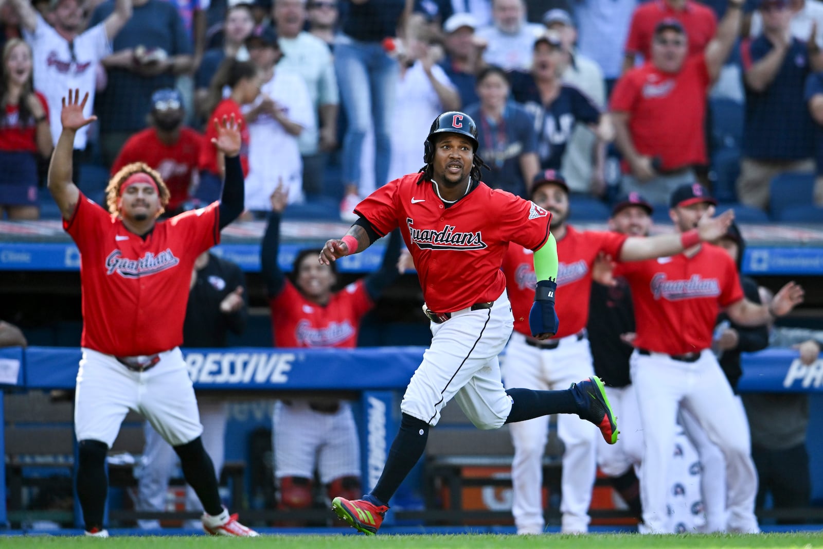 Cleveland Guardians' José Ramírez scores on a walk off RBI single hit by Andrés Giménez to defeat the Minnesota Twins 3-2 in 10 innings in a baseball game, Thursday, Sept. 19, 2024, in Cleveland. (AP Photo/Nick Cammett)