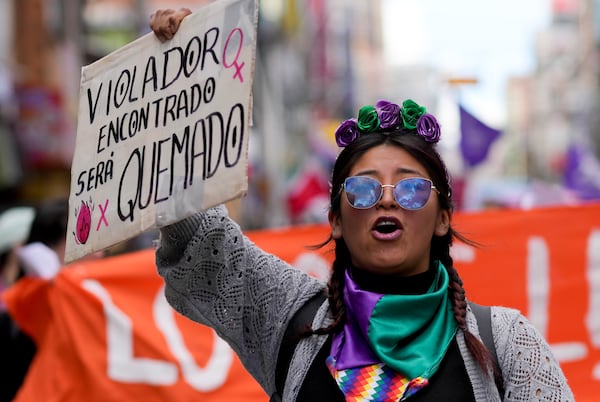 A woman chants slogans during a march marking the International Day for the Elimination of Violence against Women in El Alto, Bolivia, Monday, Nov. 25, 2024. (AP Photo/Juan Karita)