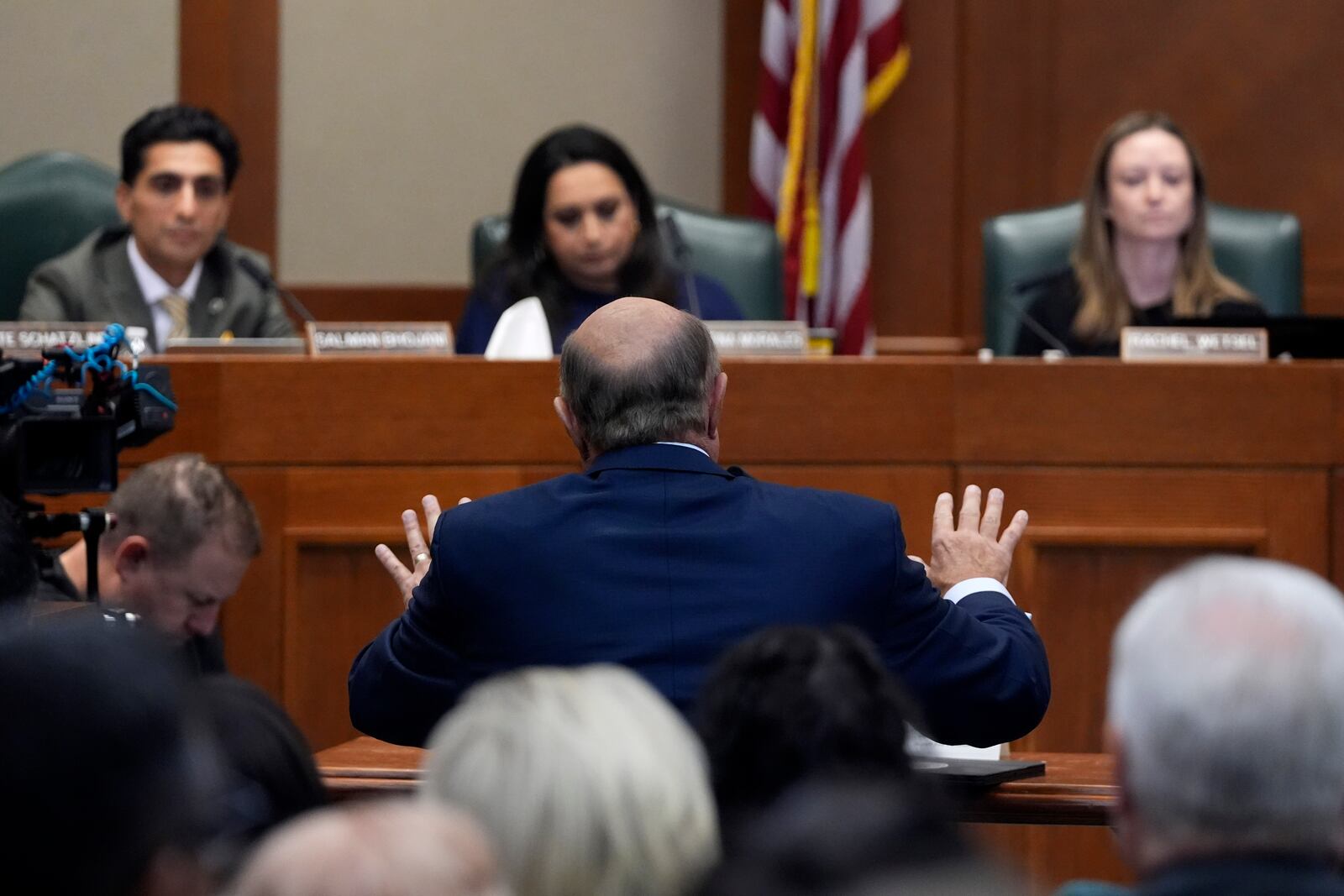 Dr. Phil McGraws, in blue suit gesturing with hands, makes comments during a committee hearing in the case of death row inmate Robert Roberson, Monday, Oct. 21, 2024, in Austin, Texas. (AP Photo/Tony Gutierrez)