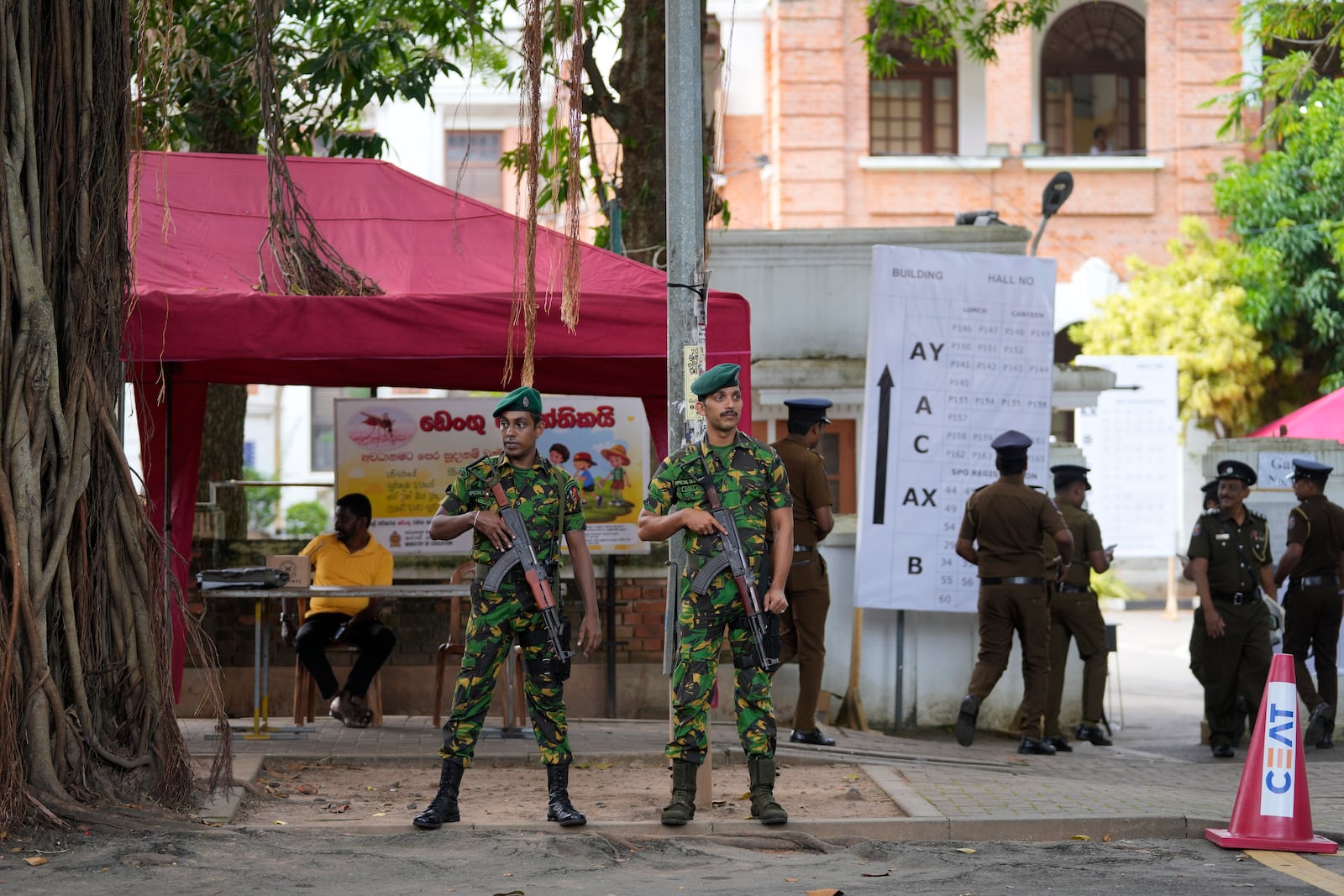 Police commandos stand guard outside a ballot counting center in Colombo, Sri Lanka, Saturday, Sept. 21, 2024. (AP Photo/Eranga Jayawardane)