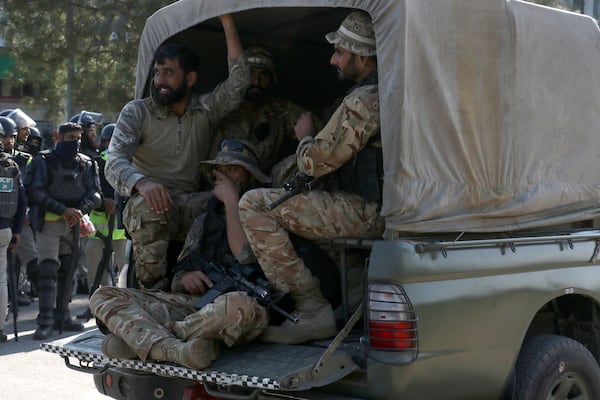 Pakistan's army troops move toward the Red Zone, which is an area that houses key government buildings, to take position ahead of the rally of supporters of imprisoned former premier Imran Khan's Pakistan Tehreek-e-Insaf party, in Islamabad, Pakistan, Tuesday, Nov. 26, 2024. (AP Photo/Ehsan Shahzad)