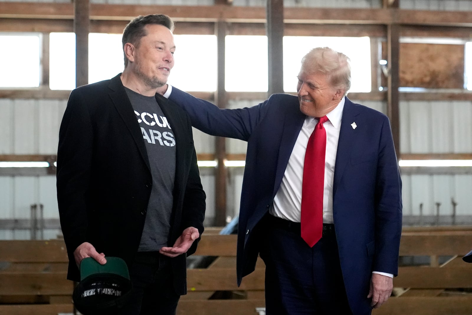 Tesla and SpaceX CEO Elon Musk, left, and Republican presidential nominee former President Donald Trump attend a campaign event at the Butler Farm Show, Saturday, Oct. 5, 2024, in Butler, Pa. (AP Photo/Alex Brandon)