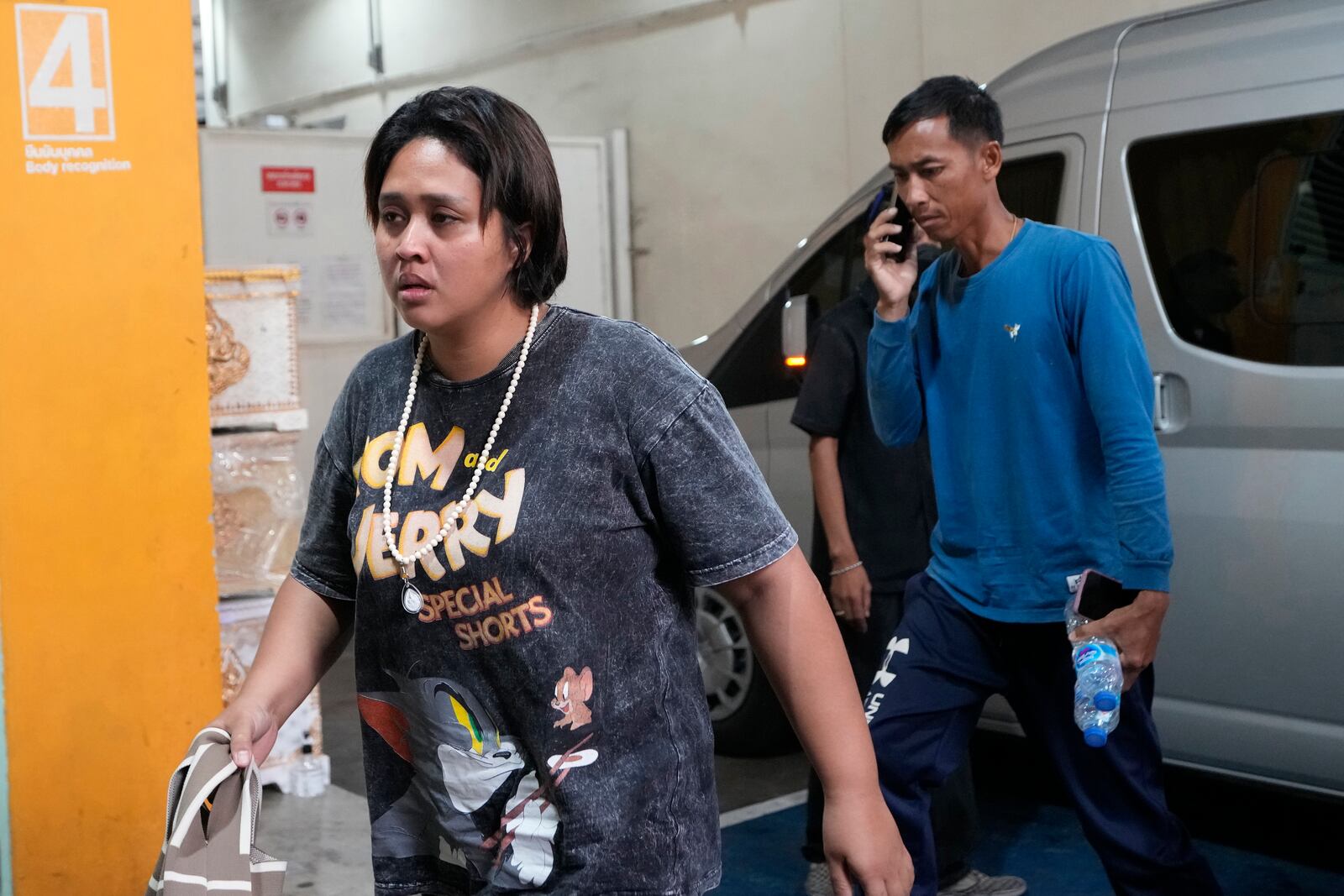 Family members of a victim arrive at a forensic police hospital in Bangkok, Thailand, Wednesday, Oct. 2, 2024. (AP Photo/Sakchai Lalit)