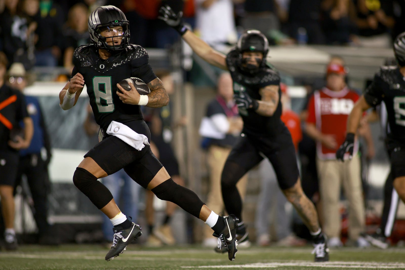 Oregon quarterback Dillon Gabriel (8) runs for a touchdown during an NCAA college football game against Ohio State, Saturday, Oct. 12, 2024, in Eugene, Ore. (AP Photo/Lydia Ely)