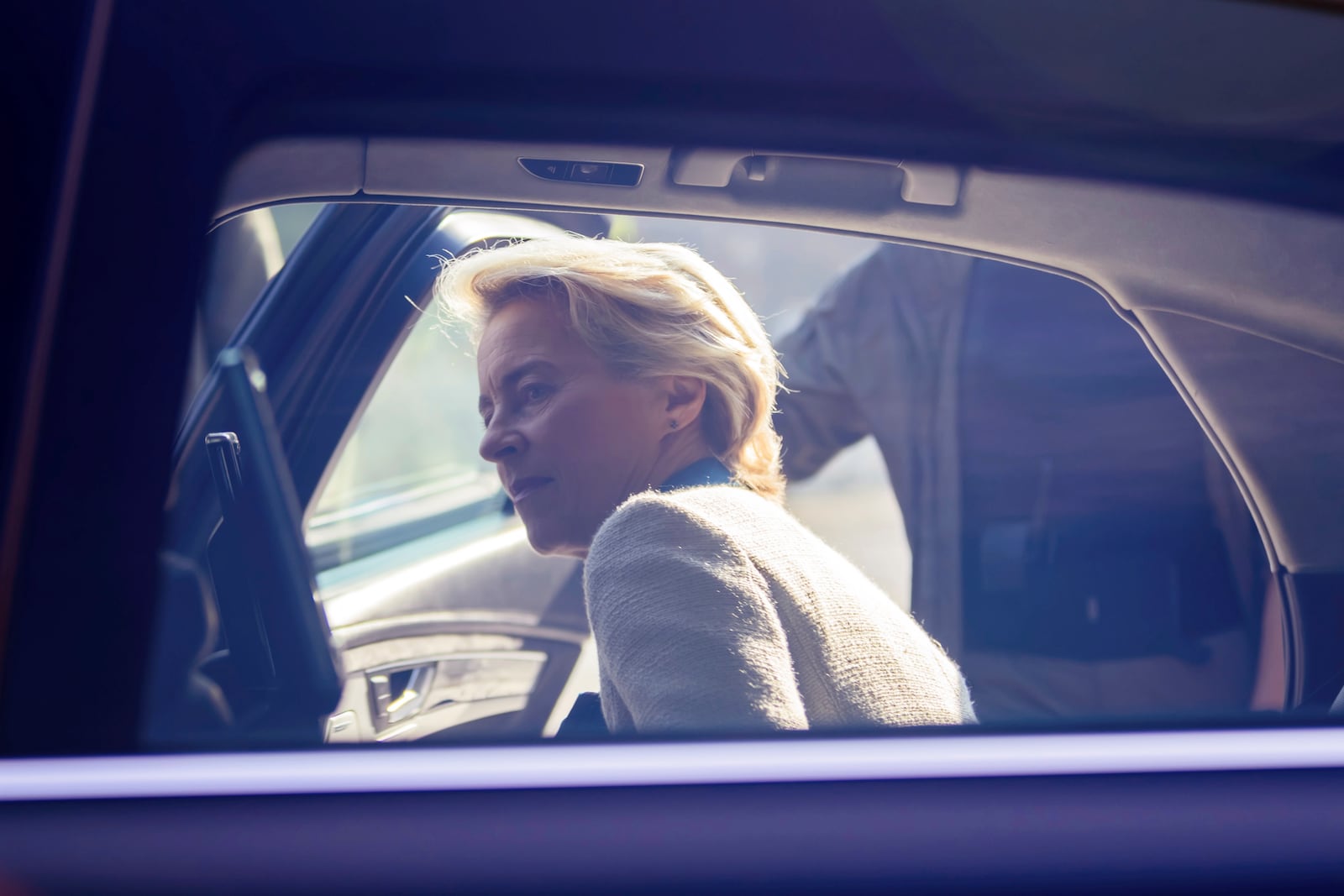 President of the European Commission Ursula von der Leyen gets into a car after visiting a memorial wall commemorating the fallen Ukrainian soldiers in the war with Russia, in Kyiv, Ukraine, Friday, Sept. 20, 2024. (Christoph Soeder, Pool via AP)