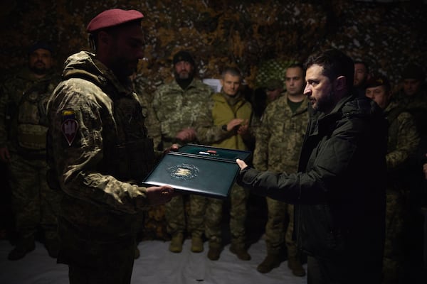 In this photo provided by the Ukrainian Presidential Press Office, Ukrainian President Volodymyr Zelenskyy awards servicemen in the frontline city of Pokrovsk, the site of heaviest battles with the Russian troops in the Donetsk region, Ukraine, Monday, Nov. 18, 2024. (Ukrainian Presidential Press Office via AP)