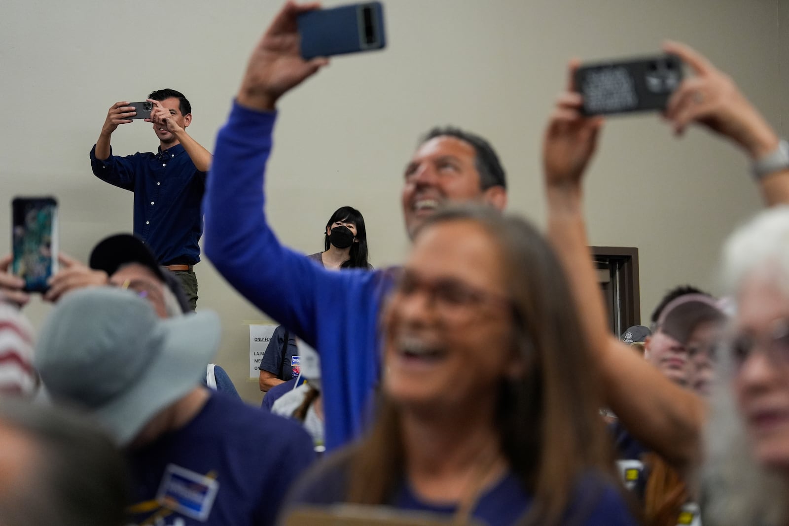 Volunteers listen to House Minority Leader Hakeem Jeffries, D-N.Y., speak at a canvass launch for George Whitesides, Sunday, Oct. 13, 2024, in Palmdale, Calif. (AP Photo/Julia Demaree Nikhinson)