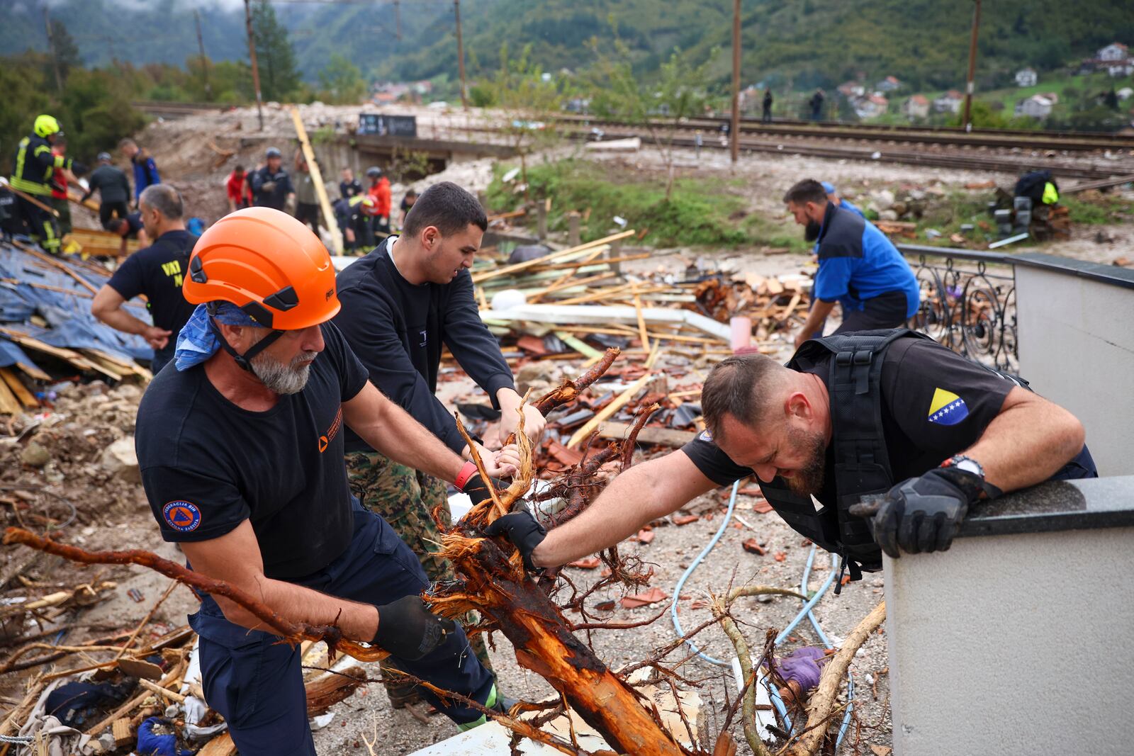 Rescuers search for missing people after floods and landslides in the village of Donja Jablanica, Bosnia, Saturday, Oct. 5, 2024. (AP Photo/Armin Durgut)