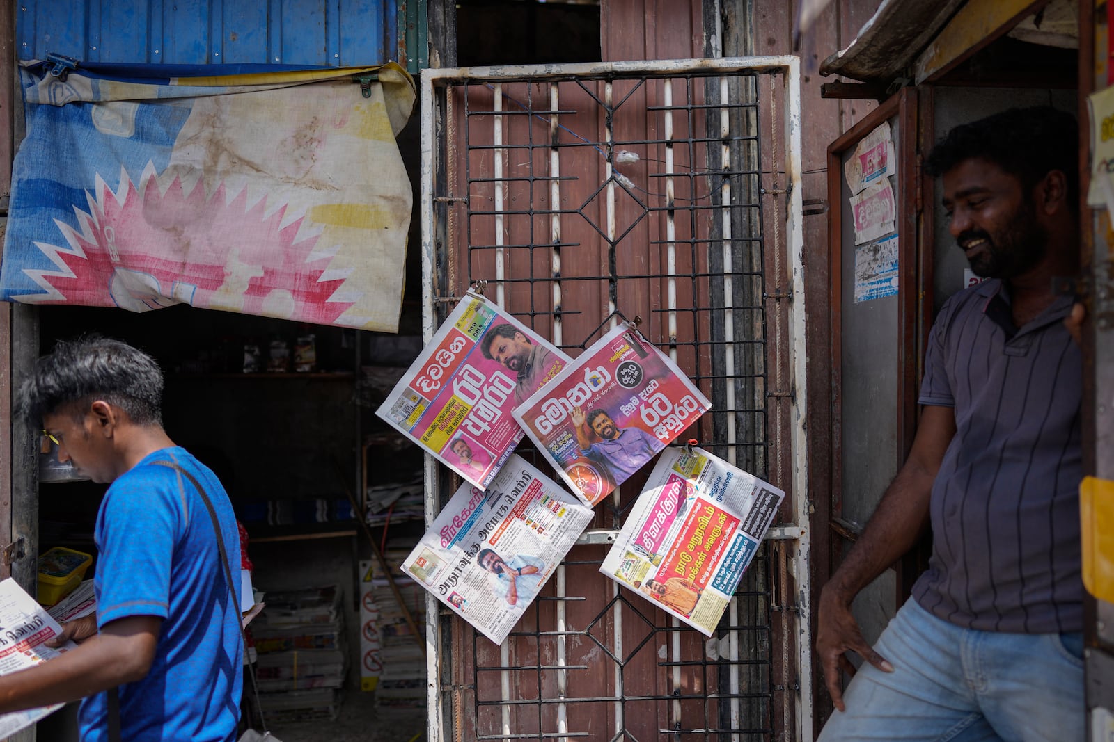 Newspapers with headlines about Sri Lanka's new president elect Marxist lawmaker Anura Kumara Dissanayake are on display in Colombo, Sri Lanka, Monday, Sept. 23, 2024. (AP Photo/Eranga Jayawardena)