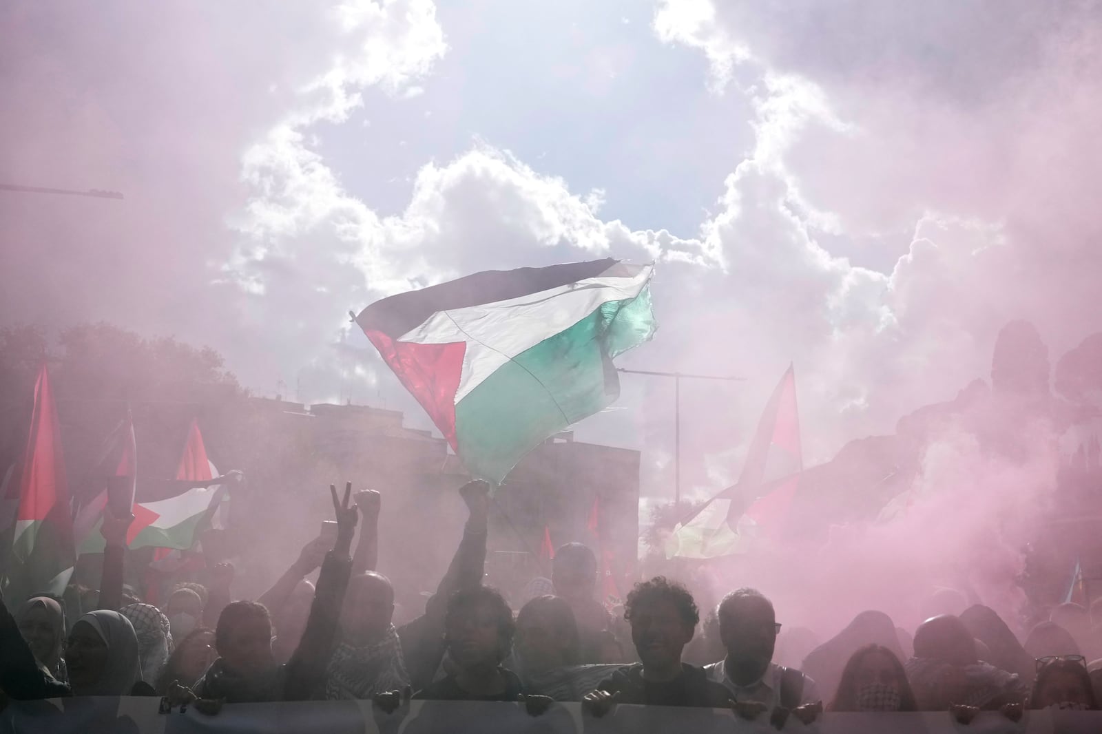 People attend at a protest in Rome, Saturday, Oct. 5, 2024. Pro-palestinians people take to the street in an unauthorised march in the centre of Rome two days ahead of the first anniversary of the Oct. 7. (AP Photo/Andrew Medichini)