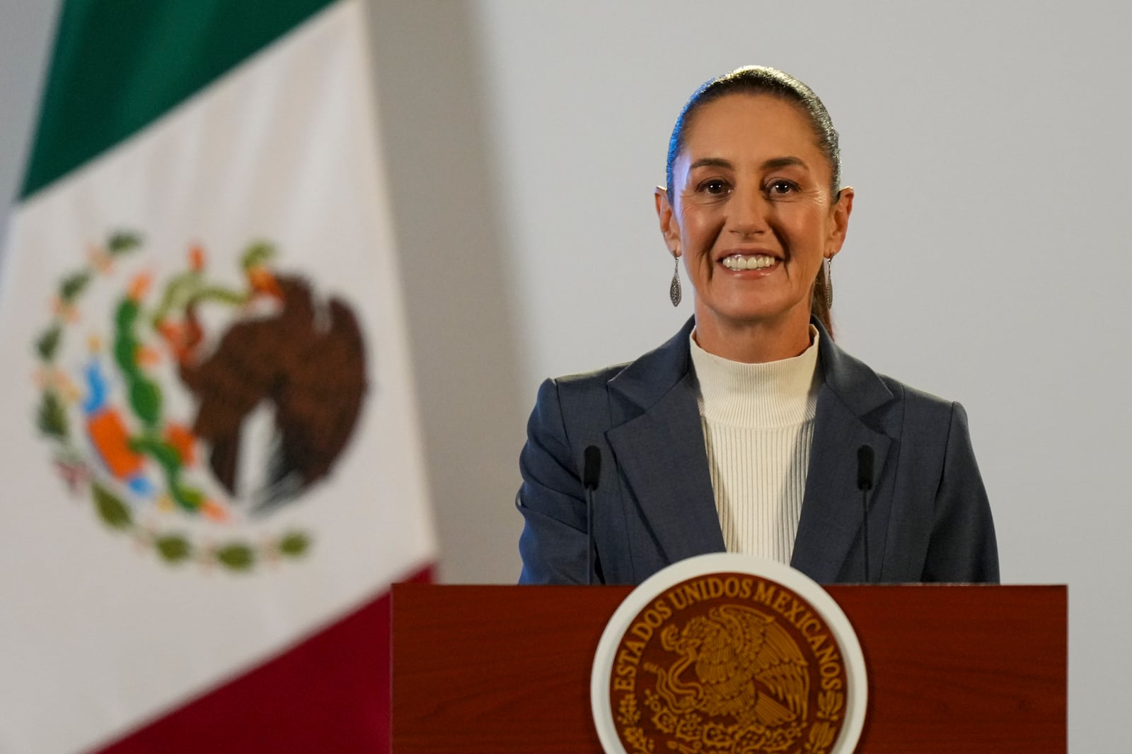 FILE - Mexican President Claudia Sheinbaum gives a media briefing from the National Palace in Mexico City, Wednesday, Oct. 2, 2024, the morning after her inauguration. (AP Photo/Fernando Llano, File)