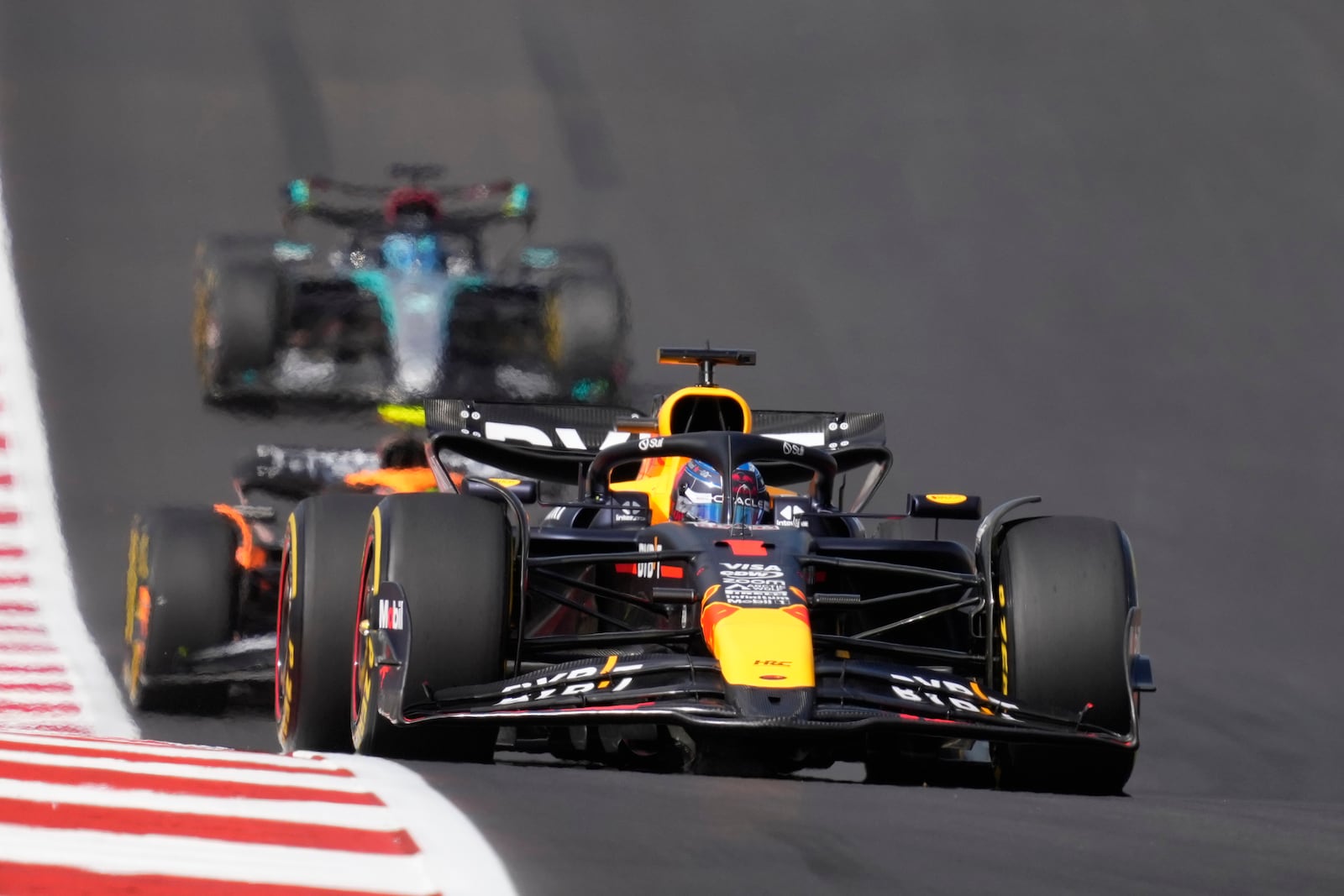 Red Bull driver Max Verstappen, of the Netherlands, steers into a turn during a sprint race ahead of the Formula One U.S. Grand Prix auto race at Circuit of the Americas, Saturday, Oct. 19, 2024, in Austin, Texas. (AP Photo/Eric Gay)