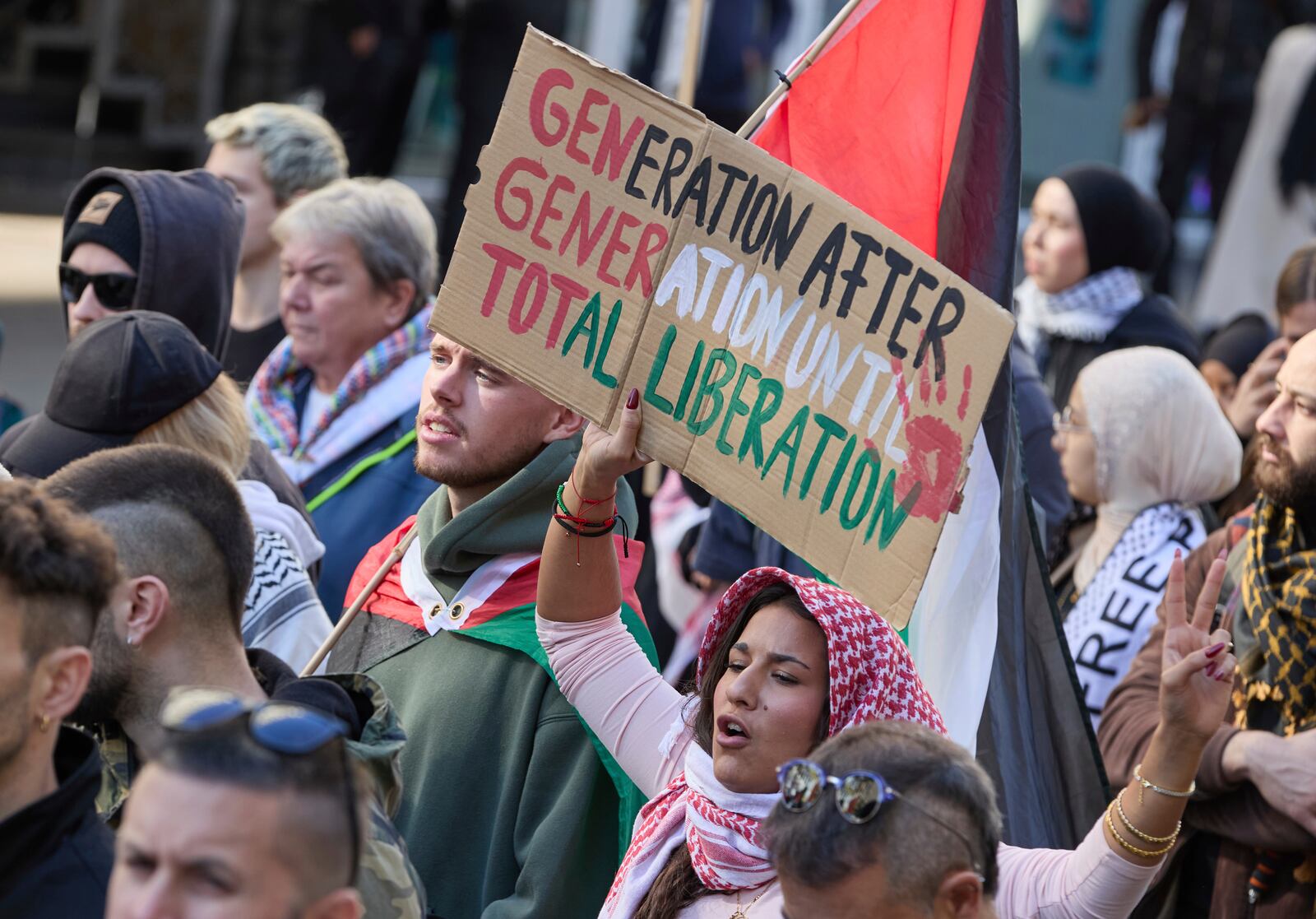 People demonstrate in support of Palestinians in Hamburg, Germany, Saturday, Oct. 5, 2024. (Georg Wendt/dpa via AP)