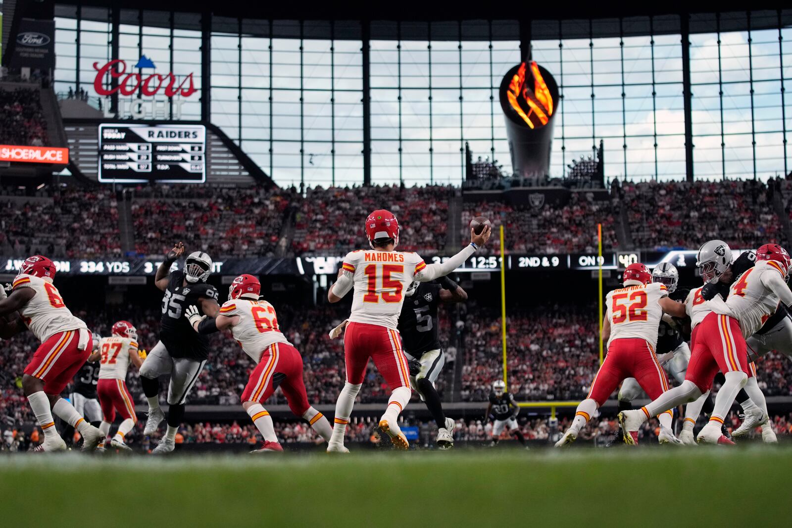 Kansas City Chiefs quarterback Patrick Mahomes (15) throws during the second half of an NFL football game against the Las Vegas Raiders Sunday, Oct. 27, 2024, in Las Vegas. (AP Photo/John Locher)