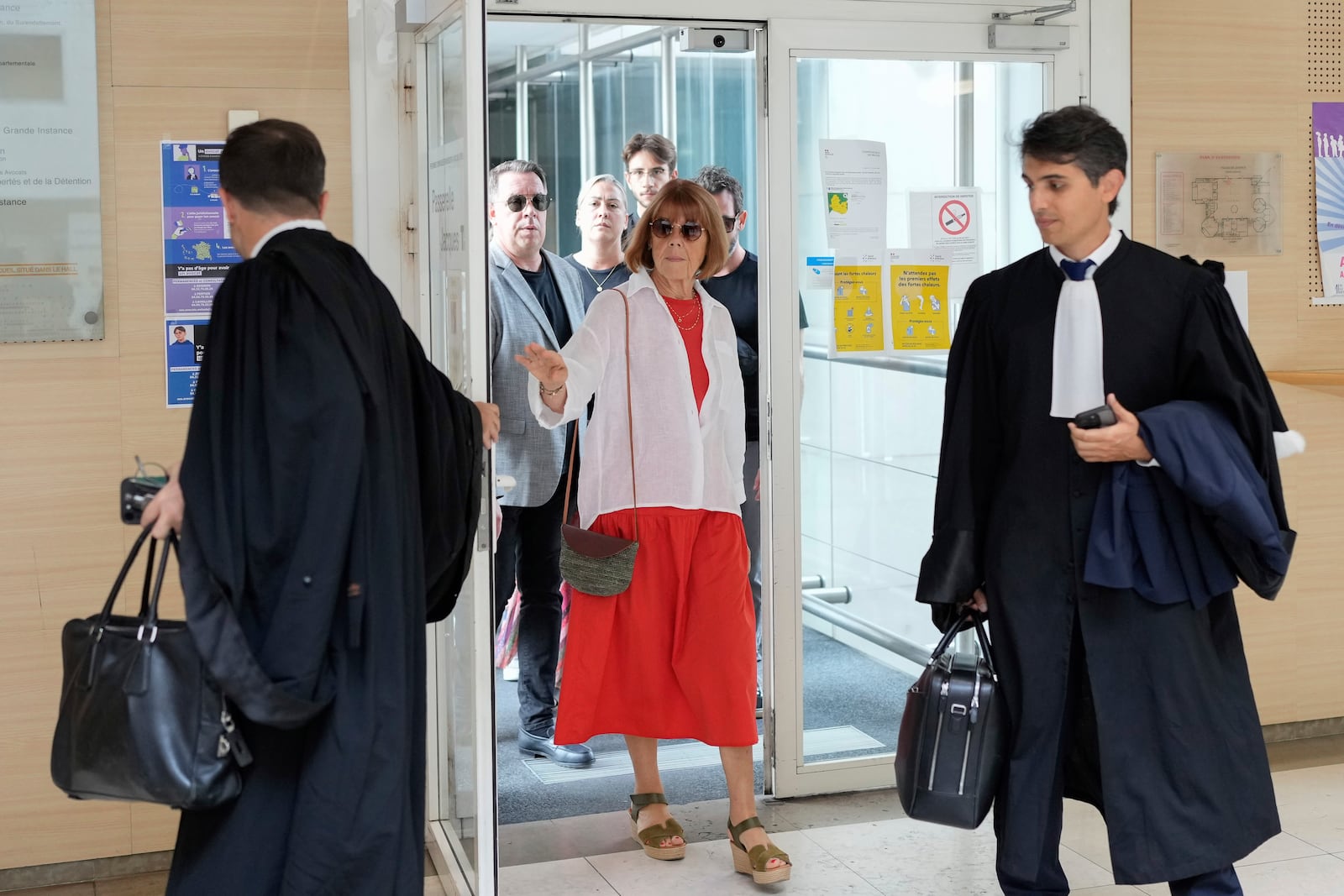 Gisele Pelicot arrives in the Avignon court house, in Avignon, southern France, Thursday, Sept. 5, 2024. A woman allegedly drugged by her ex-husband so that she could be raped by other men while she laid unconscious, is expected to testify before a panel of French judges. (AP Photo/Lewis Joly)