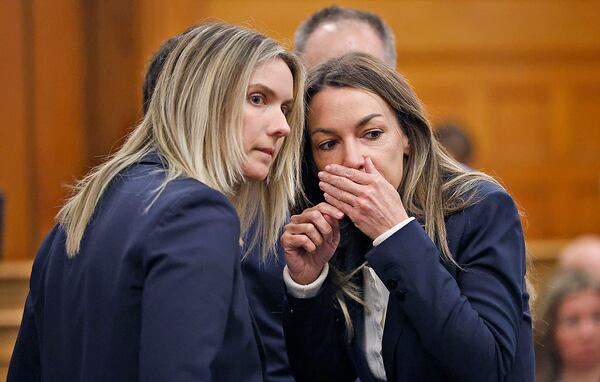 Karen Read, right, and lawyer Elizabeth Little discuss developments during Read's murder trial in Norfolk Superior Court in Dedham, Mass., Wednesday, May 21, 2025. (Greg Derr/The Patriot Ledger via AP, Pool)