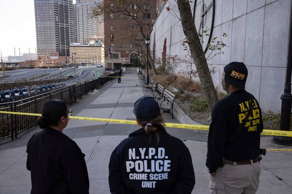 NYPD officers stand at the site of stabbing spree near the United Nations Headquarters in New York, Monday, Nov. 18, 2024. (AP Photo/Yuki Iwamura)