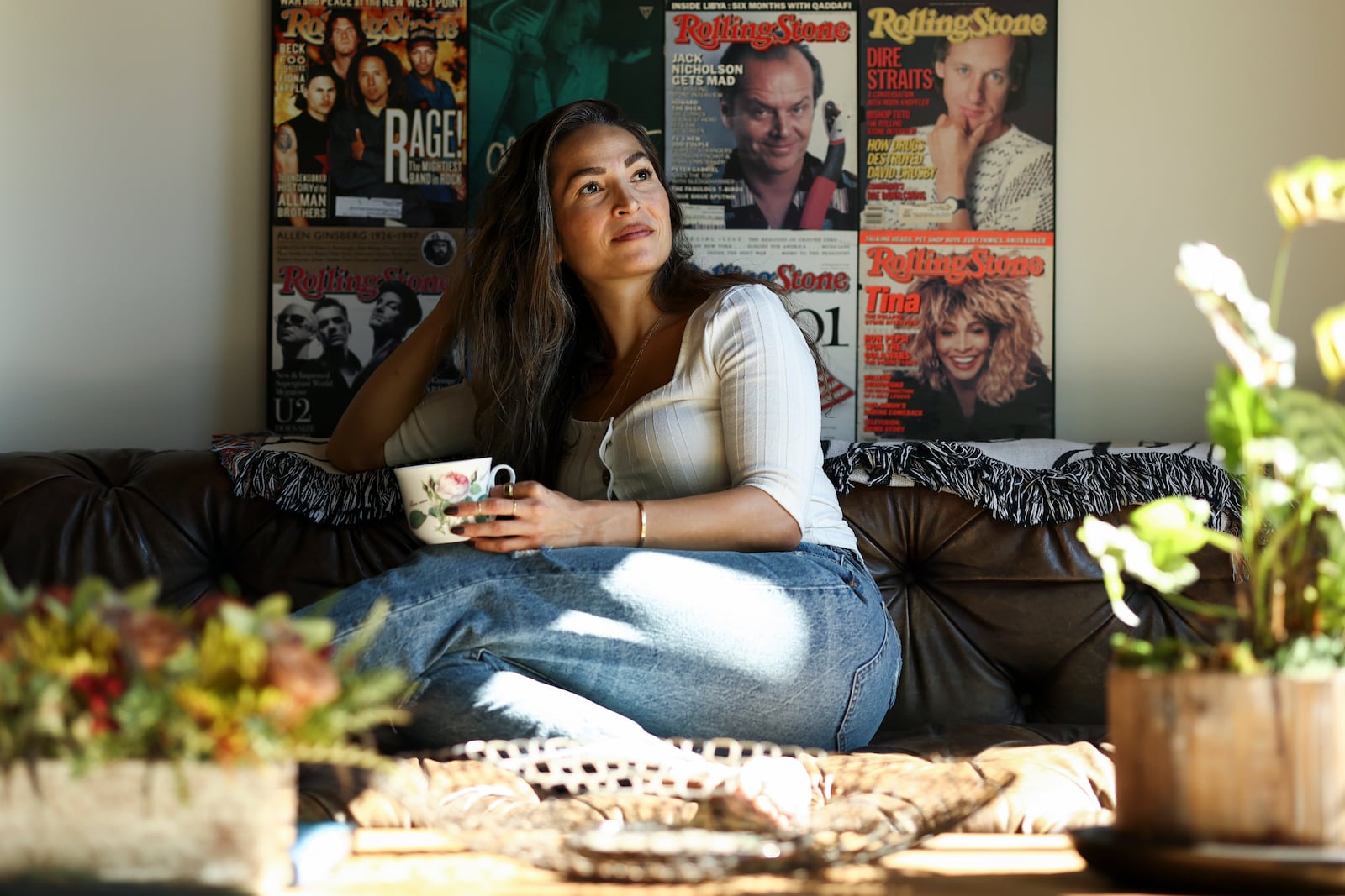 Headspace meditation teacher, Rosie Acosta, looks on in her living room Monday, Sept. 30, 2024, in Woodland Hills, Calif. (AP Photo/Jessie Alcheh)