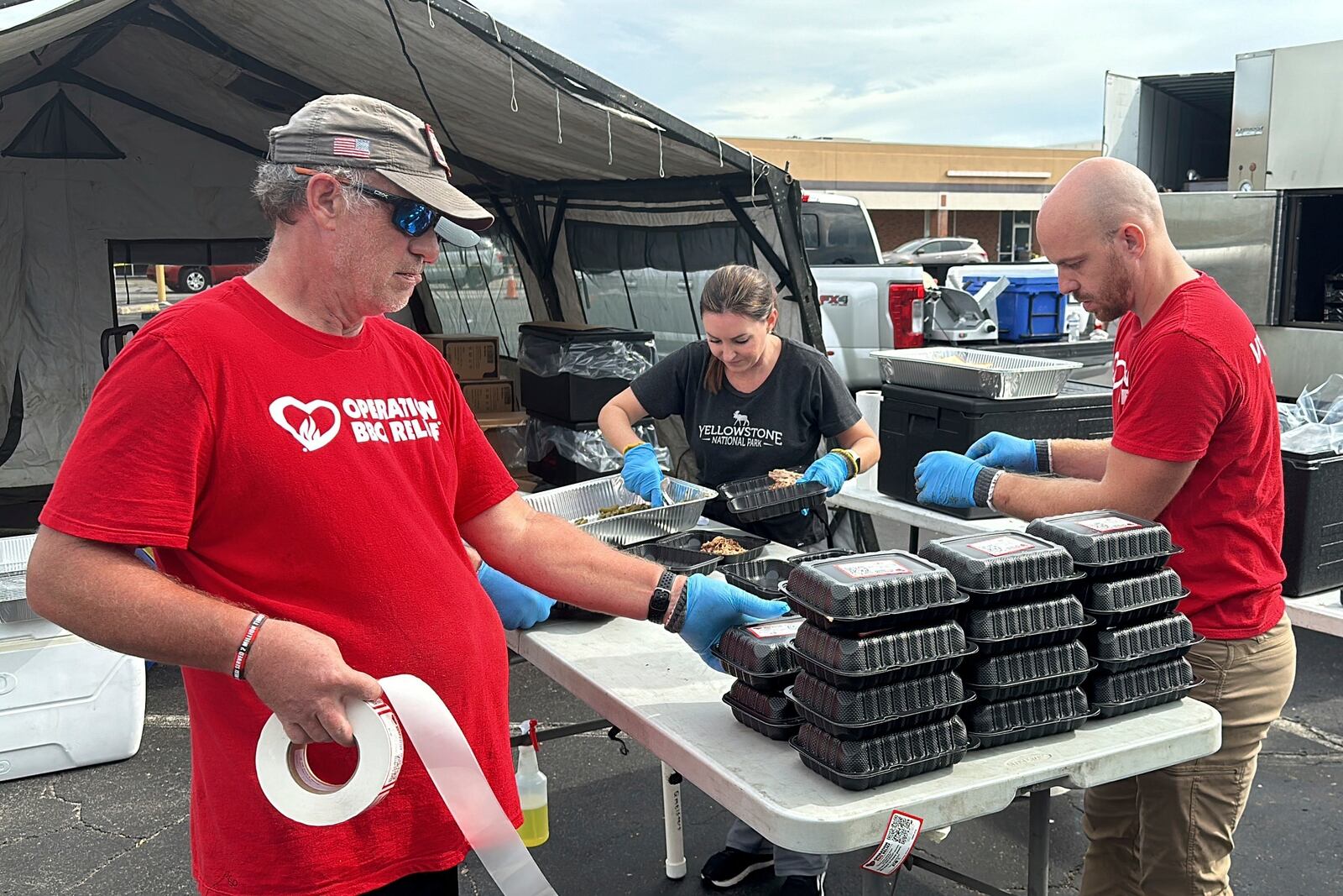 Volunteers for Operation BBQ Relief prepare meals for people without power or water, Oct. 1, 2024, in Augusta, Georgia. (AP Photo / Jeffrey Collins)