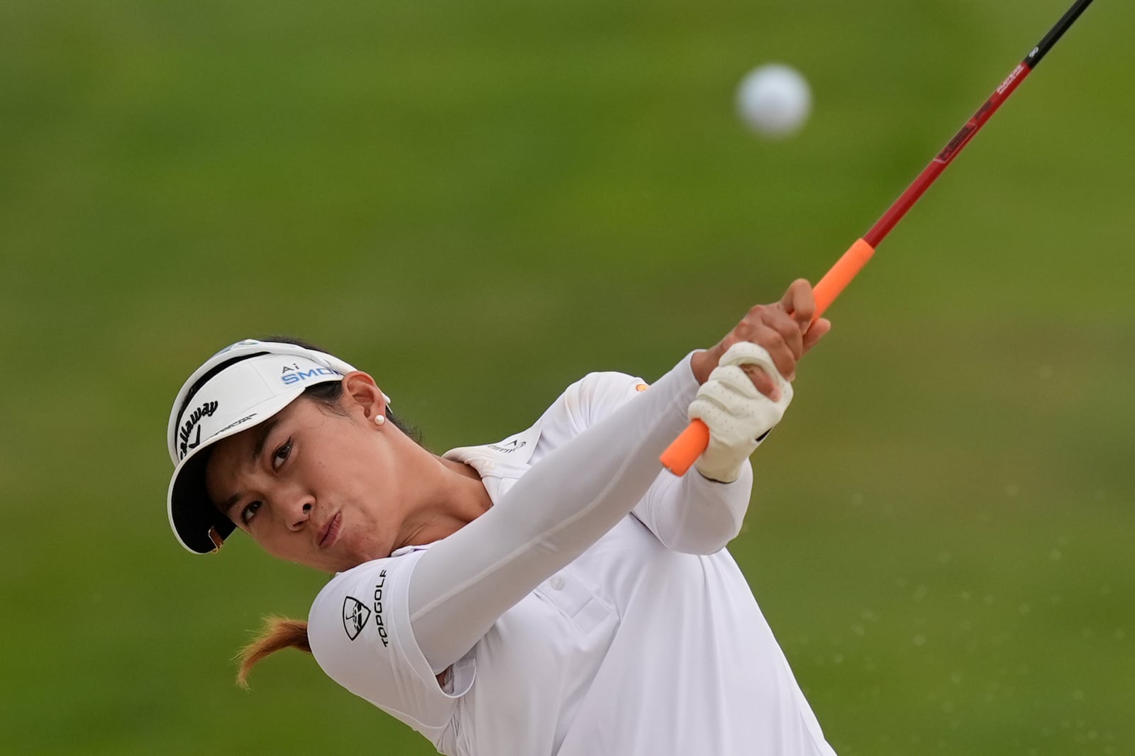 Jeeno Thitikul, of Thailand, hits out of a bunker on the 17th hole during the final round of the LPGA Kroger Queen City Championship golf tournament at TPC River's Bend in Maineville, Ohio, Sunday, Sept. 22, 2024. (AP Photo/Carolyn Kaster)