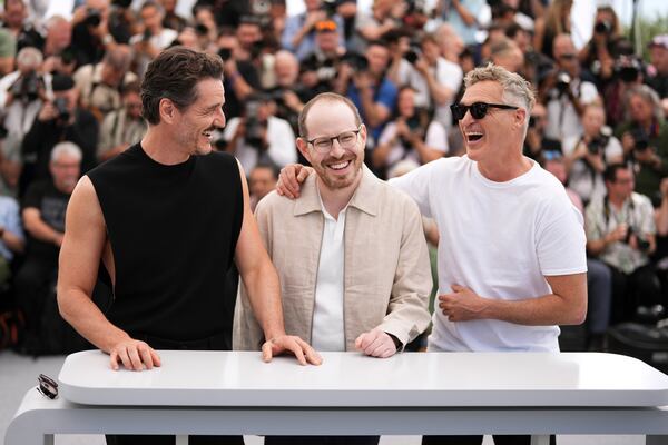 Pedro Pascal, from left, director Ari Aster and Joaquin Phoenix pose for photographers at the photo call for the film 'Eddington' at the 78th international film festival, Cannes, southern France, Saturday, May 17, 2025. (Photo by Scott A Garfitt/Invision/AP)