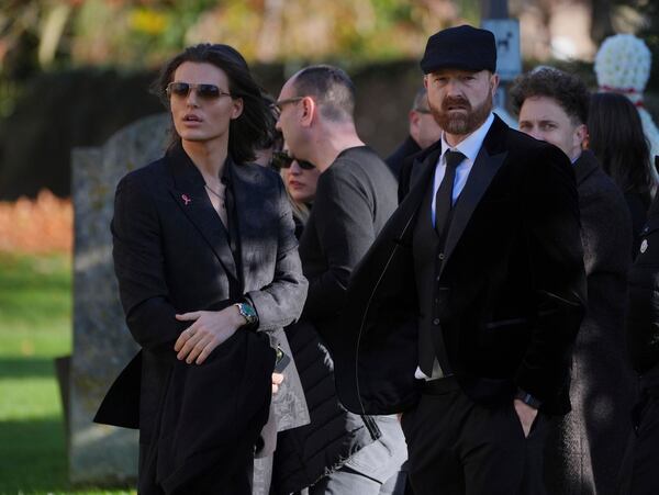 Damian Hurley, left, arrives the funeral service of One Direction singer Liam Payne at St Mary's Church in Amersham, England, Wednesday, Nov. 20, 2024. (Jonathan Brady/PA via AP)