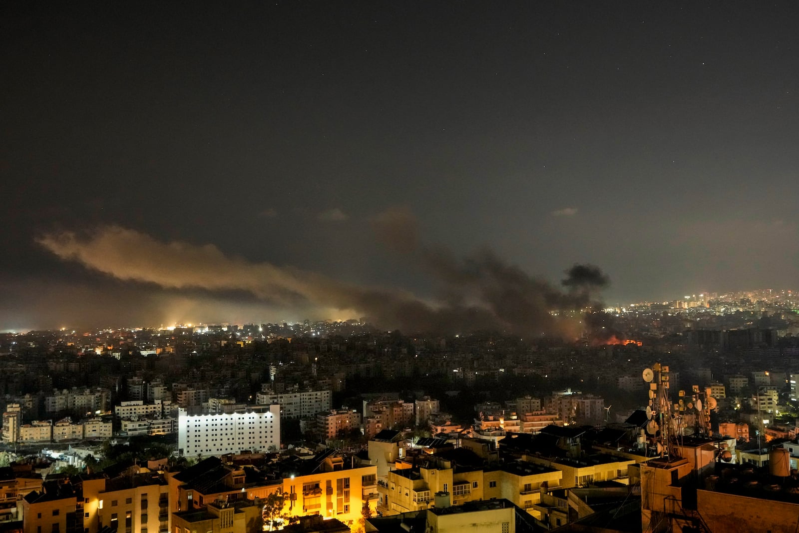 Smoke rises after Israeli airstrikes in Dahiyeh, Beirut, Lebanon, Saturday, Oct. 5, 2024. (AP Photo/Bilal Hussein)