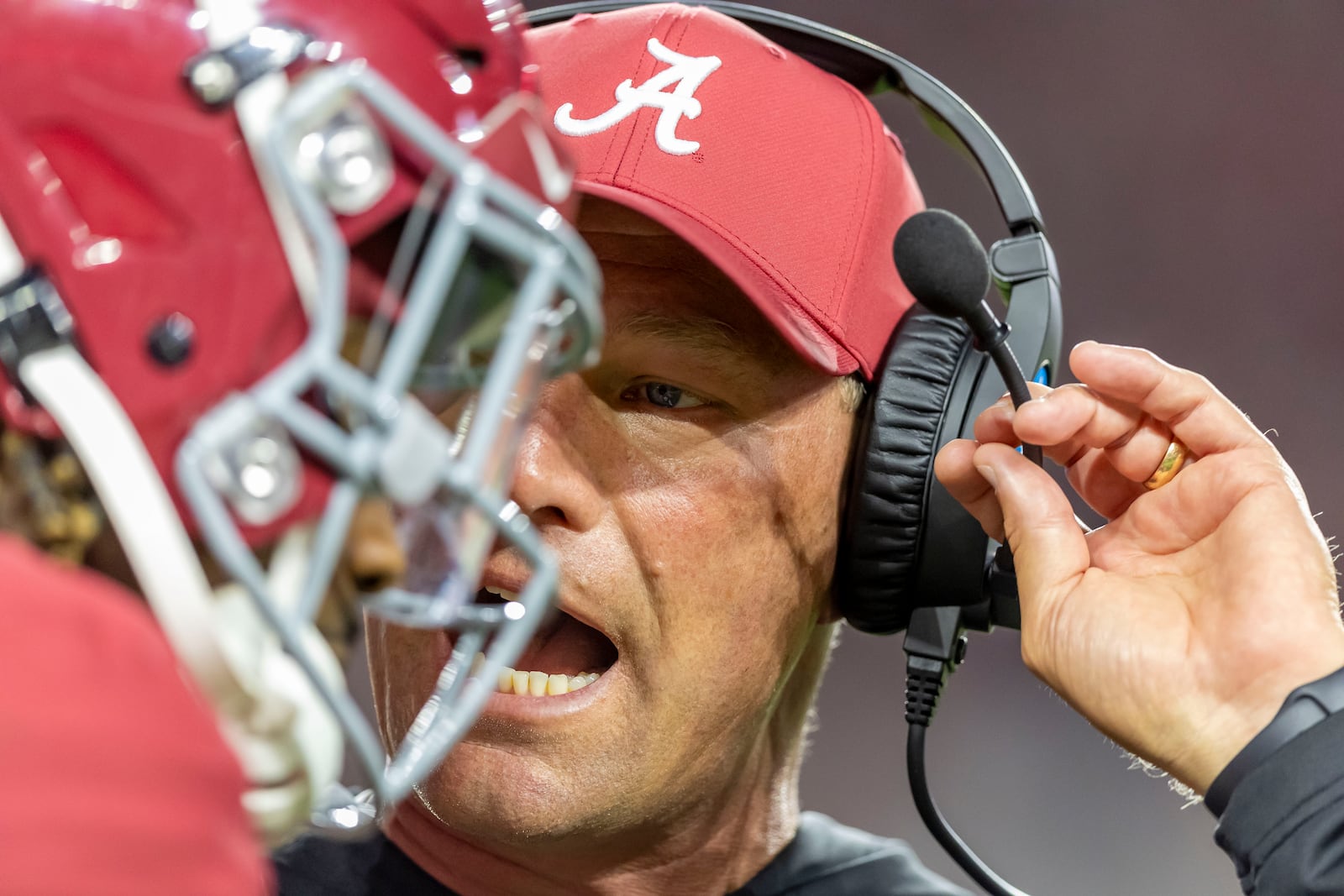 Alabama head coach Kalen DeBoer talks with Alabama quarterback Jalen Milroe between plays during the first half of an NCAA college football game against Georgia, Saturday, Sept. 28, 2024, in Tuscaloosa, Ala. (AP Photo/Vasha Hunt)