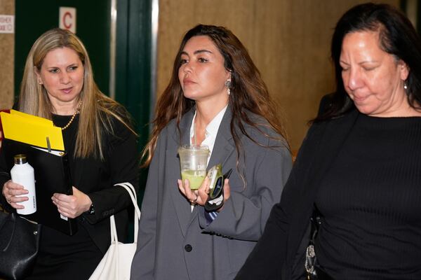 Miriam Haley, center, an accuser testifying at Harvey Weinstein's rape trial, arrives to the courtroom after a break in New York, Tuesday, April 29, 2025. (AP Photo/Seth Wenig)