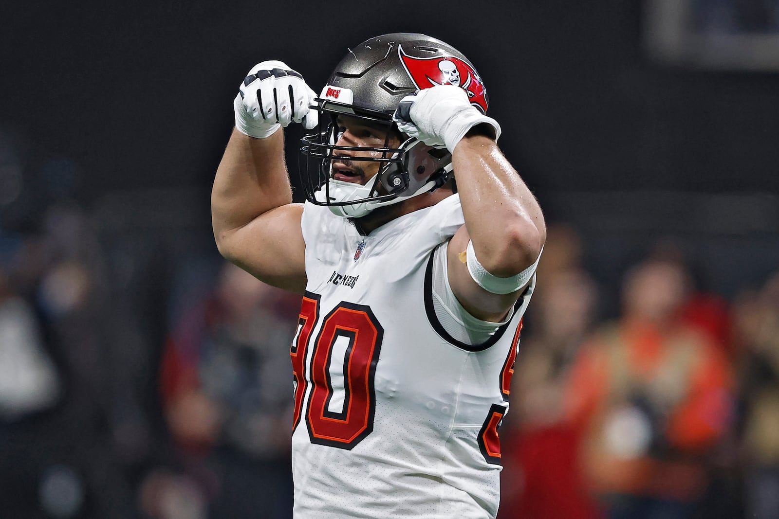 Tampa Bay Buccaneers defensive end Logan Hall (90) reacts after sacking Atlanta Falcons quarterback Kirk Cousins during the first half of an NFL football game Thursday, Oct. 3, 2024, in Atlanta. (AP Photo/Butch Dill)