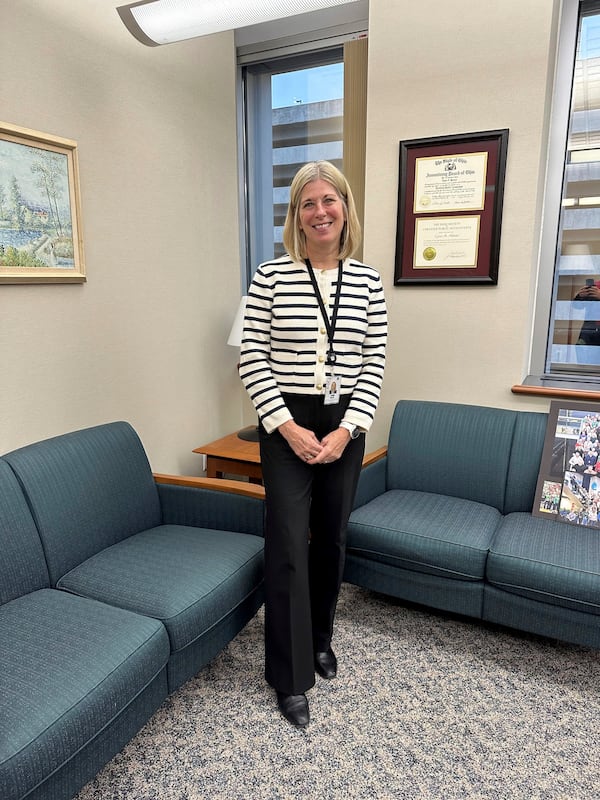 Acting Executive Director and Chief Financial Officer Lynn Hoover poses in her office at the headquarters of the State Teachers Retirement System in Columbus, Ohio, on Friday, Nov. 22, 2024. (AP Photo/Julie Carr Smyth)