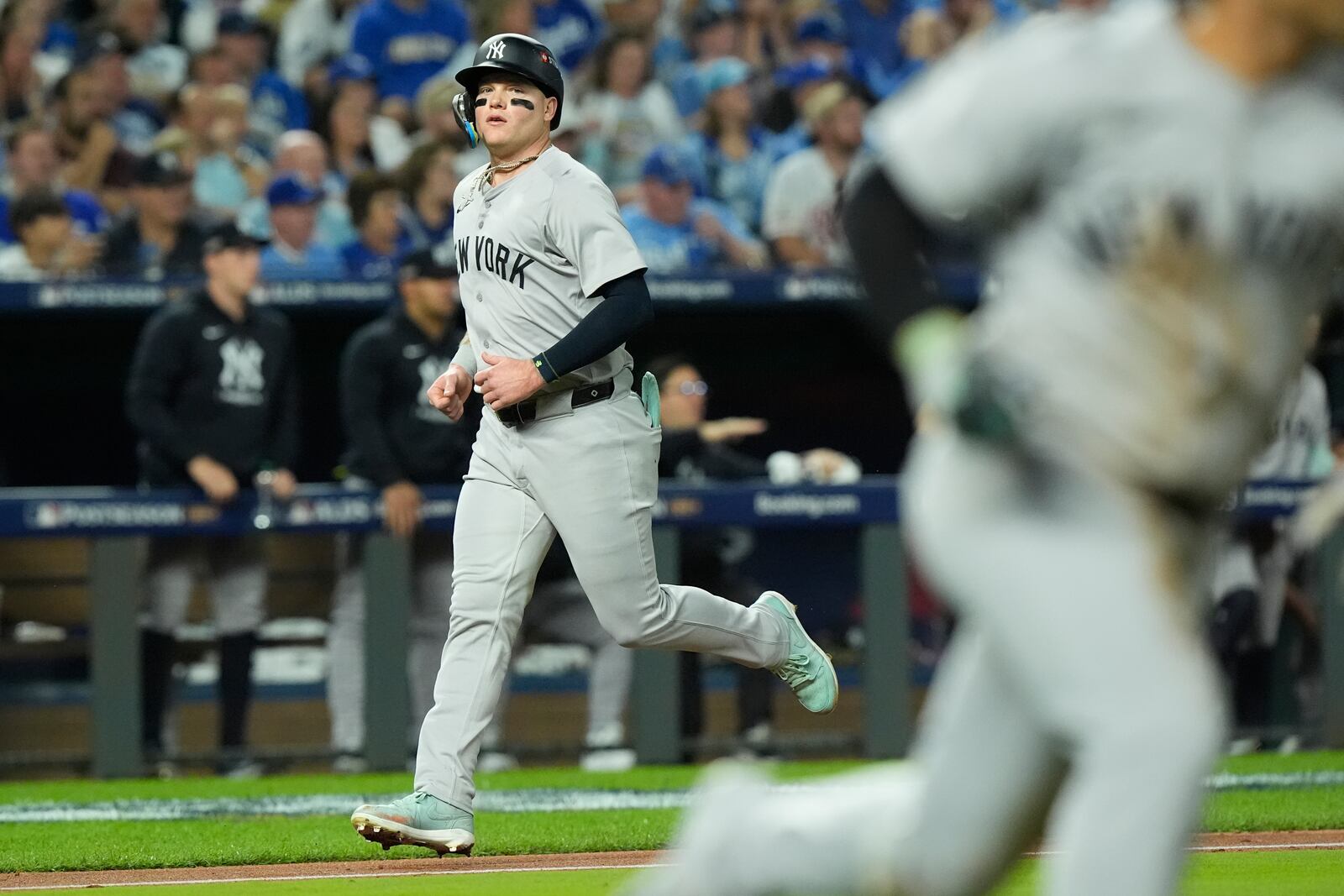 New York Yankees' Alex Verdugo scores during the fifth inning in Game 4 of an American League Division baseball playoff series against the Kansas City Royals Thursday, Oct. 10, 2024, in Kansas City, Mo. (AP Photo/Charlie Riedel)