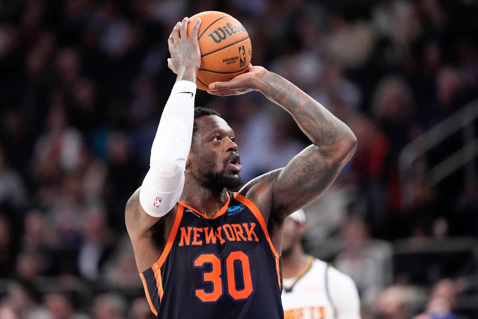 FILE - New York Knicks forward Julius Randle looks to shoot a free throw in the second half of an NBA basketball game against the Denver Nuggets, on Jan. 25, 2024, at Madison Square Garden in New York. (AP Photo/Mary Altaffer, File)