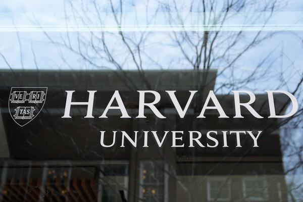 FILE - The Harvard University logo is displayed on a building at the school, Tuesday, April 15, 2025, in Cambridge, Mass. (AP Photo/Charles Krupa, File)