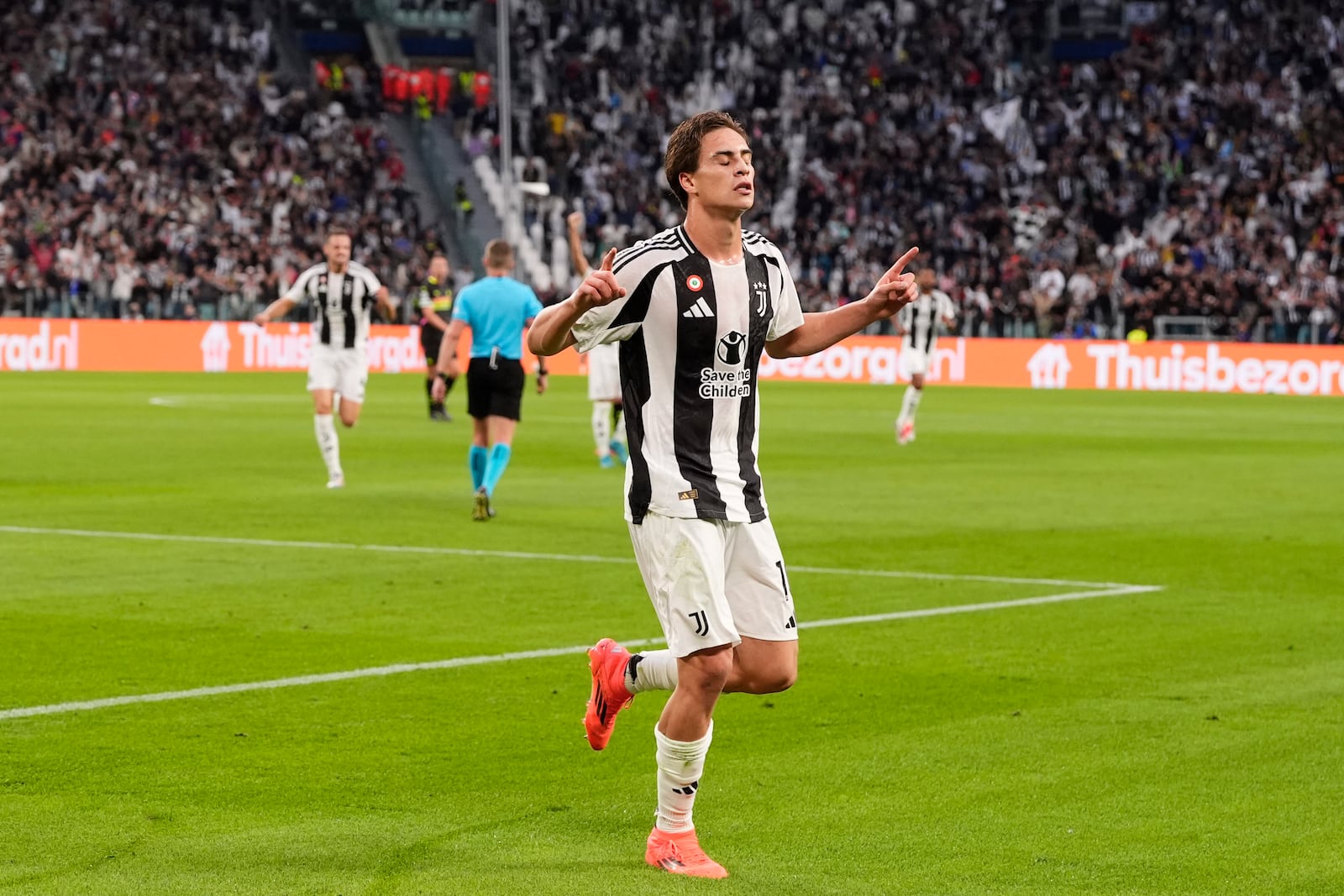 Juventus' Kenan Yildiz celebrates after scoring the opening goal during the Champions League opening phase soccer match between Juventus and PSV Eindhoven at the Juventus stadium in Turin, Italy, Tuesday, Sept. 17, 2024. (Fabio Ferrari/LaPresse via AP)