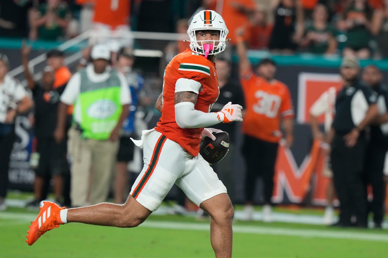 Miami tight end Elijah Arroyo (8) runs for a touchdown during the first half of an NCAA college football game against Virginia Tech , Friday, Sept. 27, 2024, in Miami Gardens, Fla. (AP Photo/Marta Lavandier)