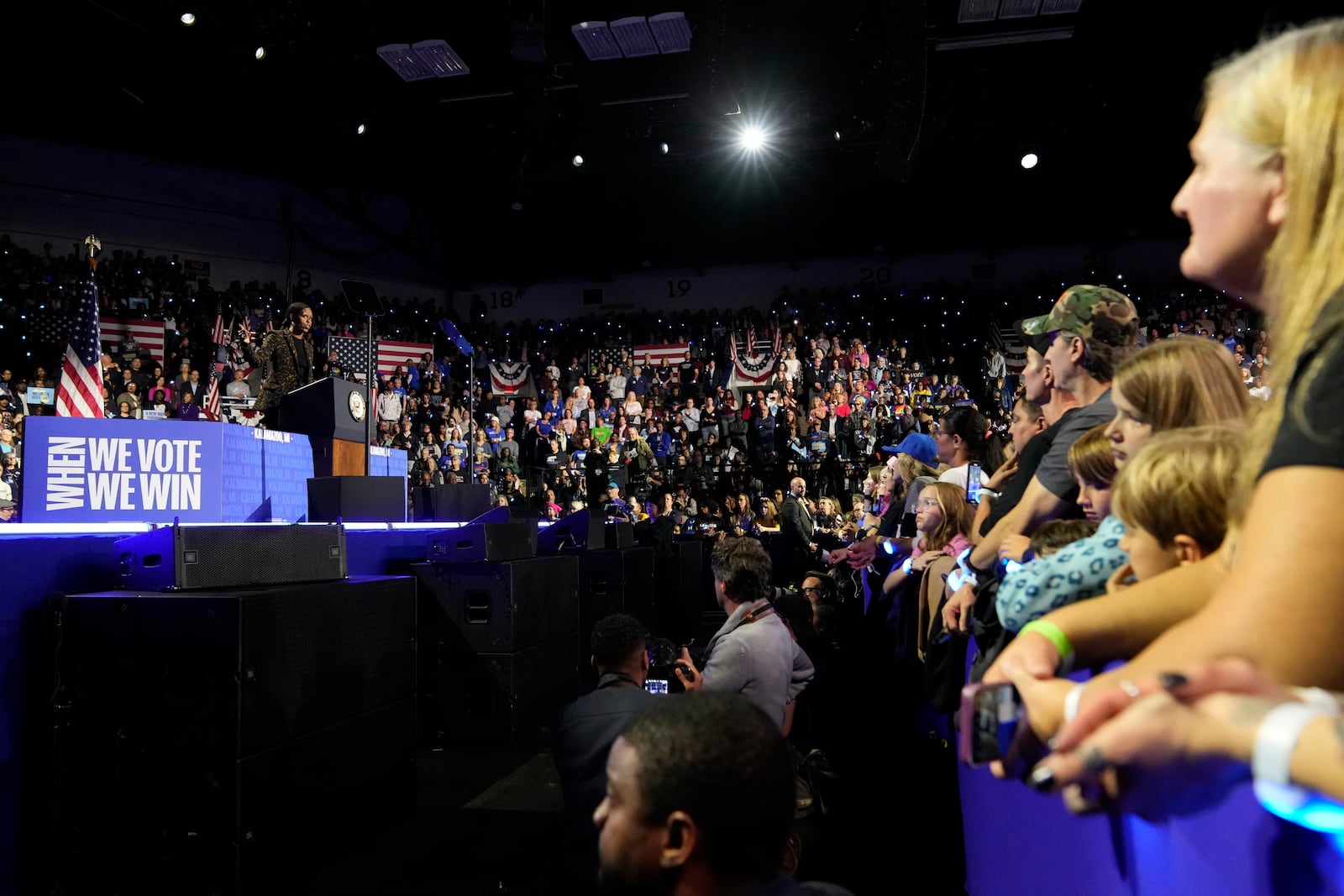 Supporters listen as former first lady Michelle Obama speaks at a campaign rally for democratic presidential nominee Vice President Kamala Harris at the Wings Event Center, in Kalamazoo, Mich., Saturday, Oct. 26, 2024.(AP Photo/Jacquelyn Martin)