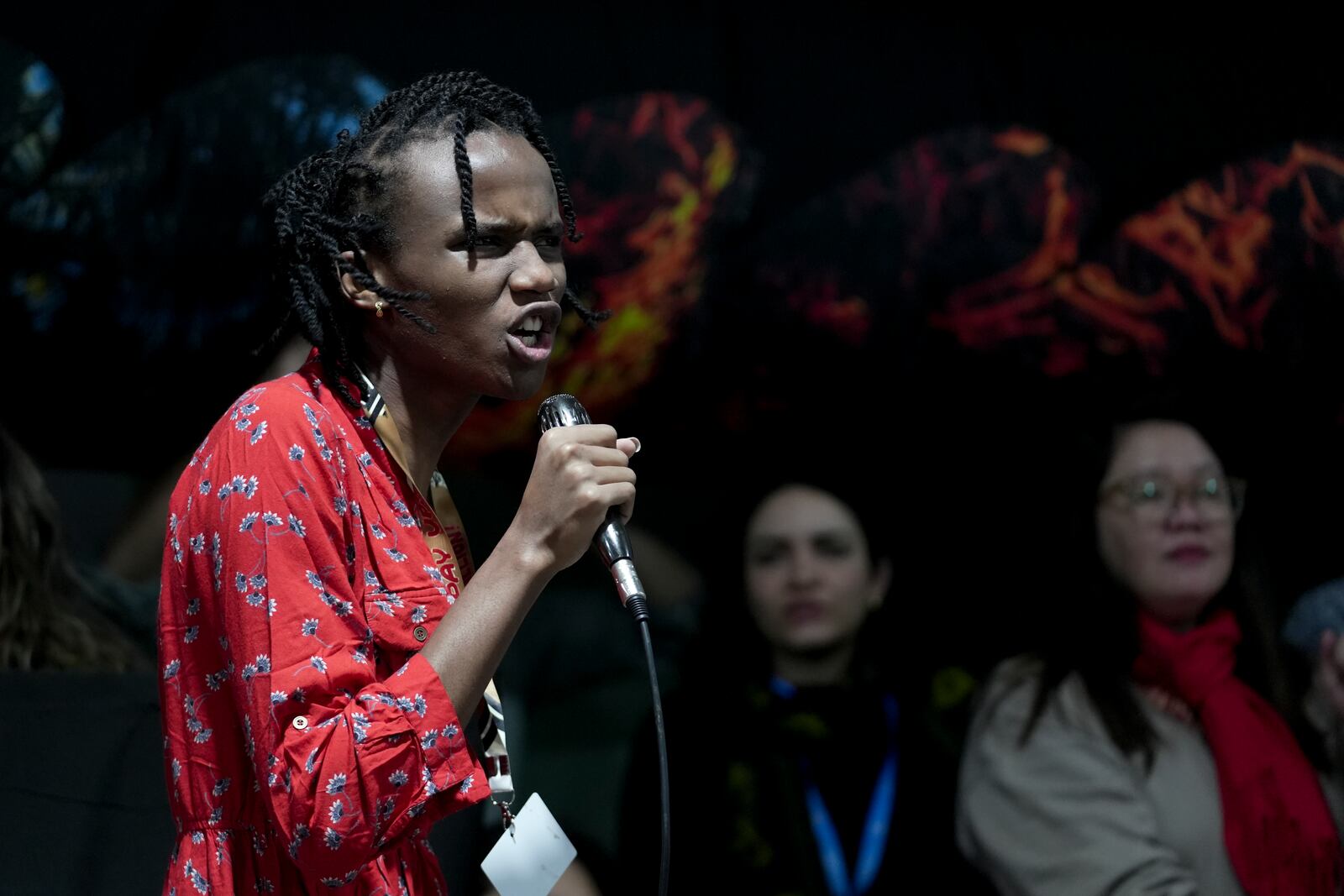 Eric Njuguna, of Kenya, participates in a demonstration against fossil fuels called weed out the snakes at the COP29 U.N. Climate Summit, Friday, Nov. 15, 2024, in Baku, Azerbaijan. (AP Photo/Joshua A. Bickel)